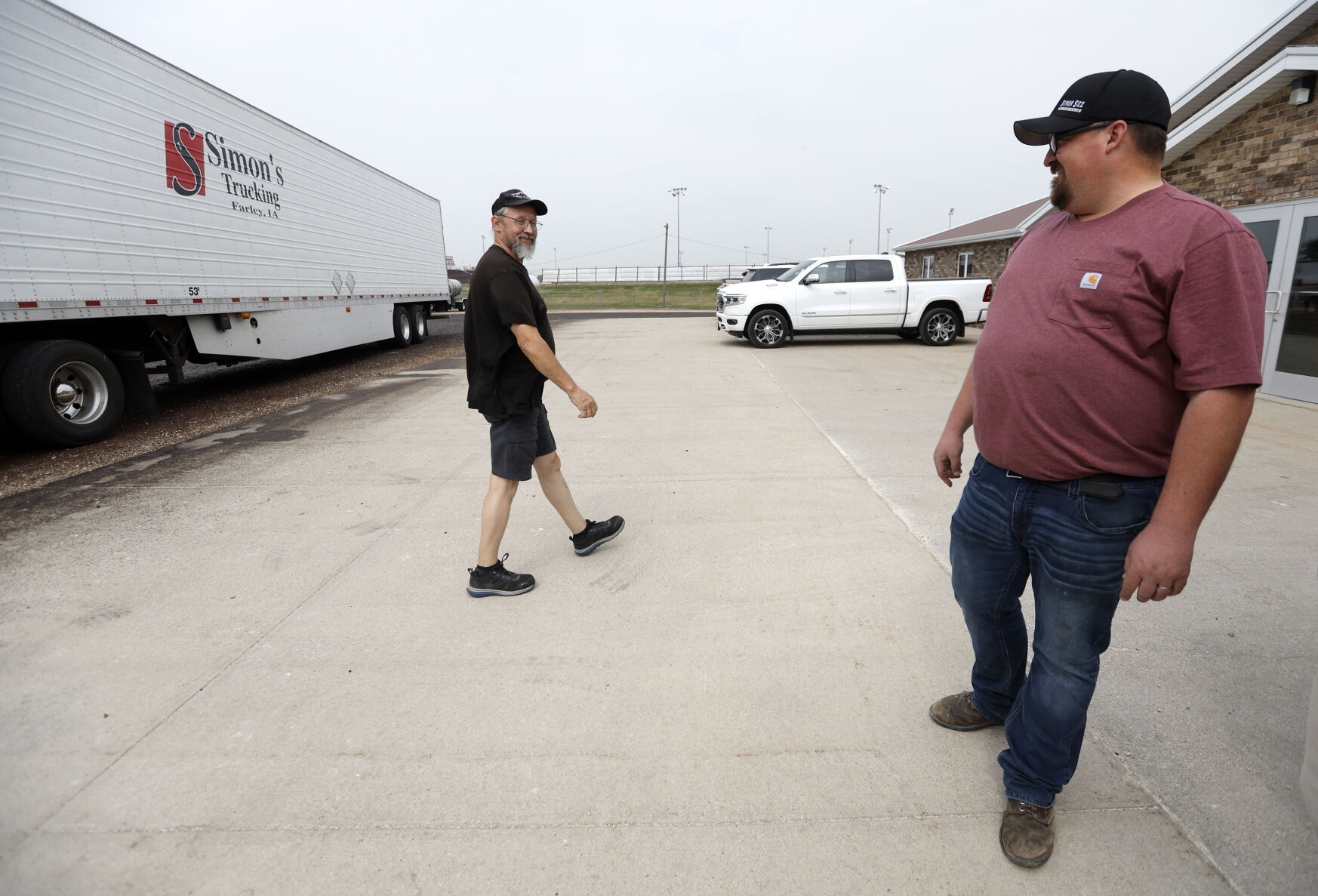 Driver Don Menke (left) talks with RJ Simon at Simon