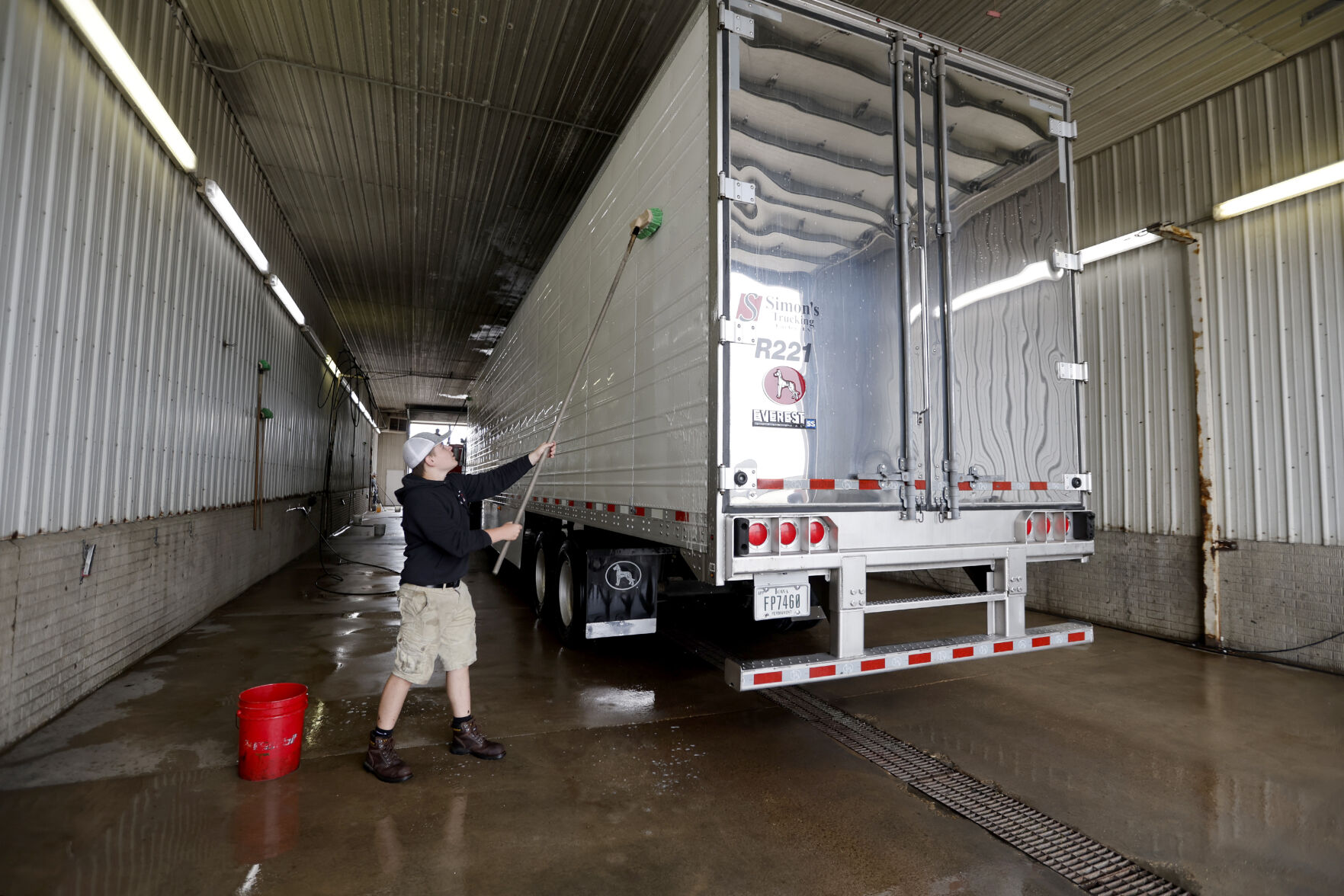 Andrew Daly washes a semi at Simon’s Trucking.    PHOTO CREDIT: File photo