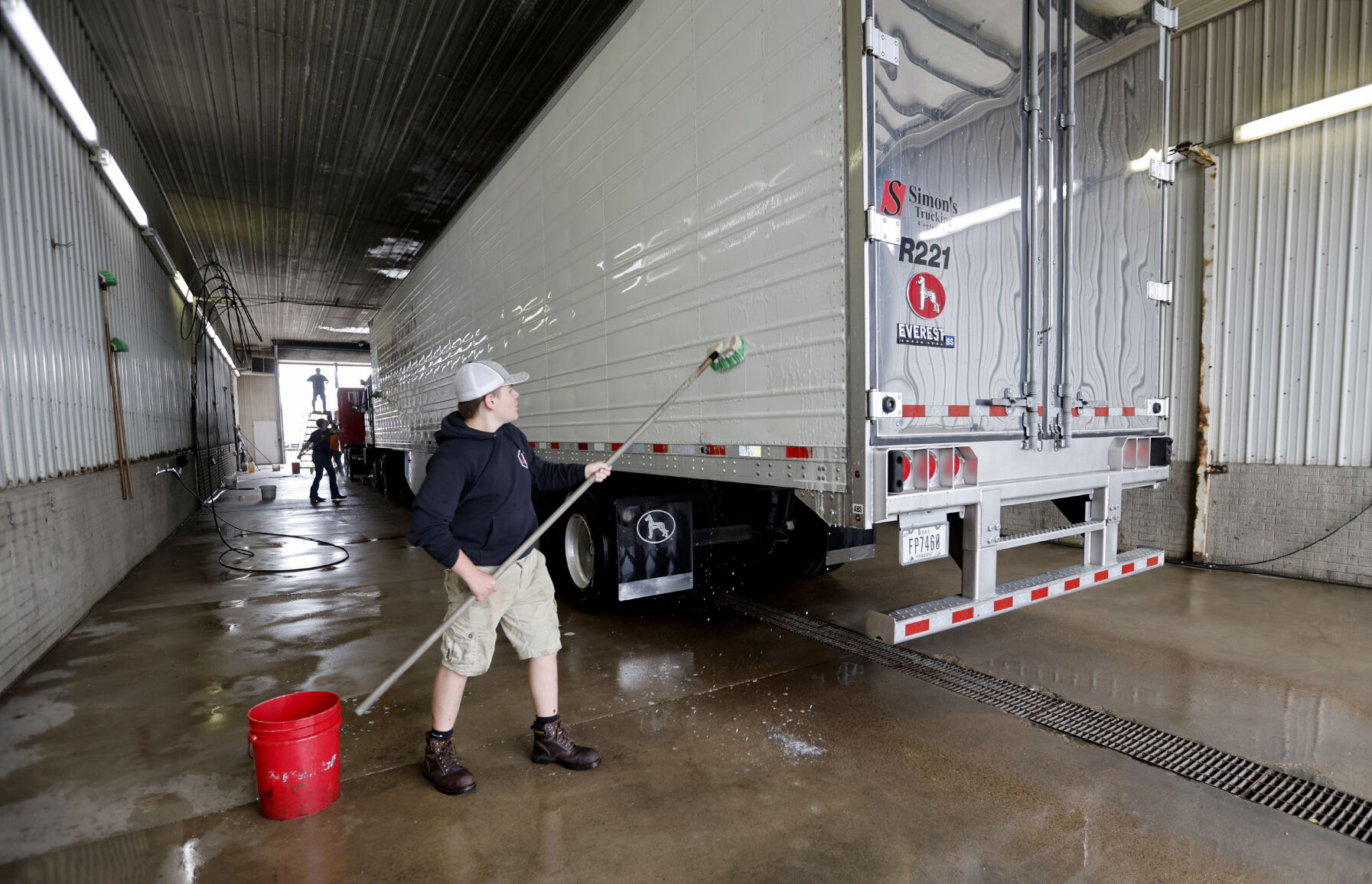 Andrew Daly washes a semi at Simon