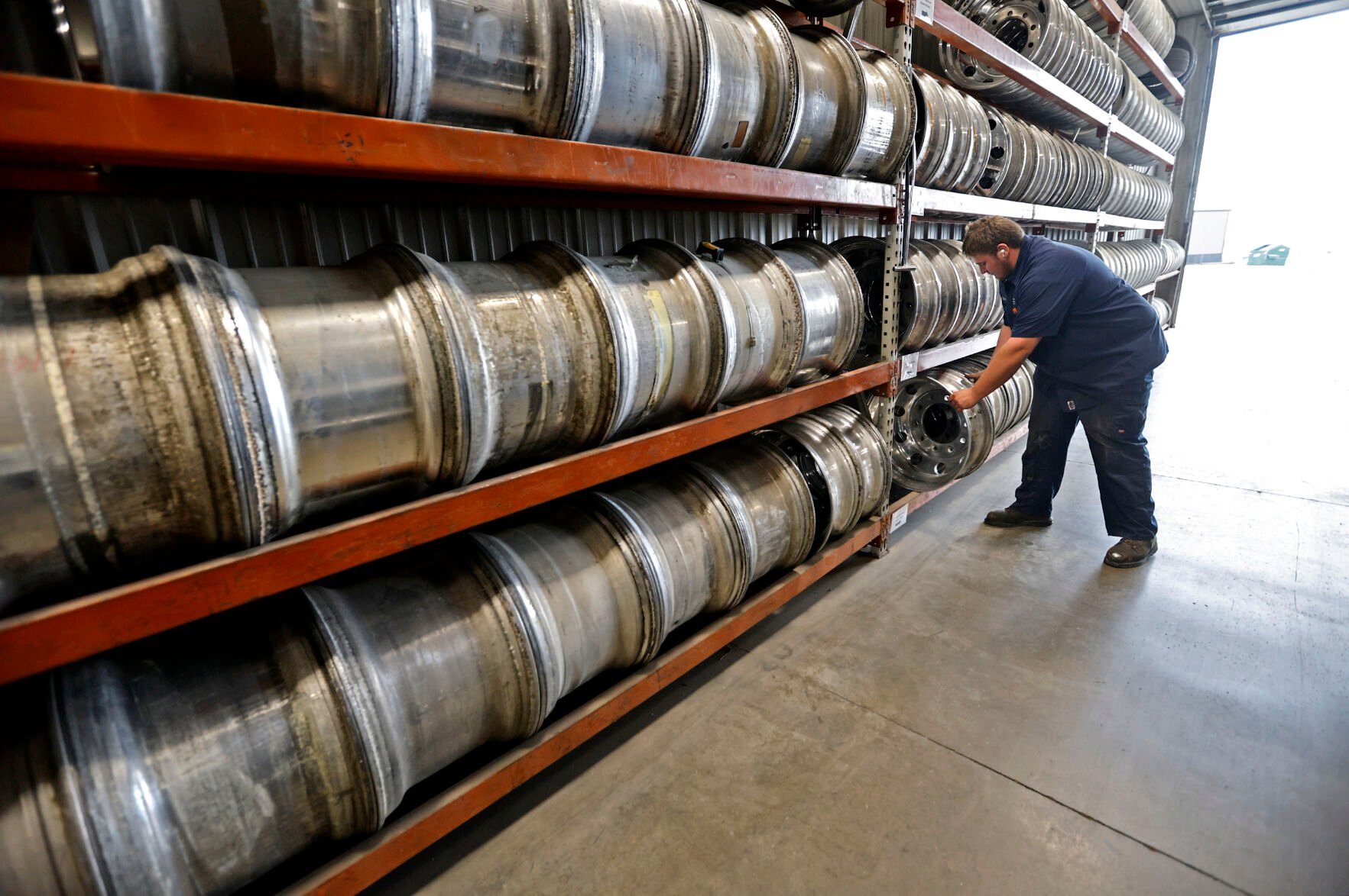 Donavan Hurley sorts items at Simon’s Trucking in Farley, Iowa.    PHOTO CREDIT: File photo