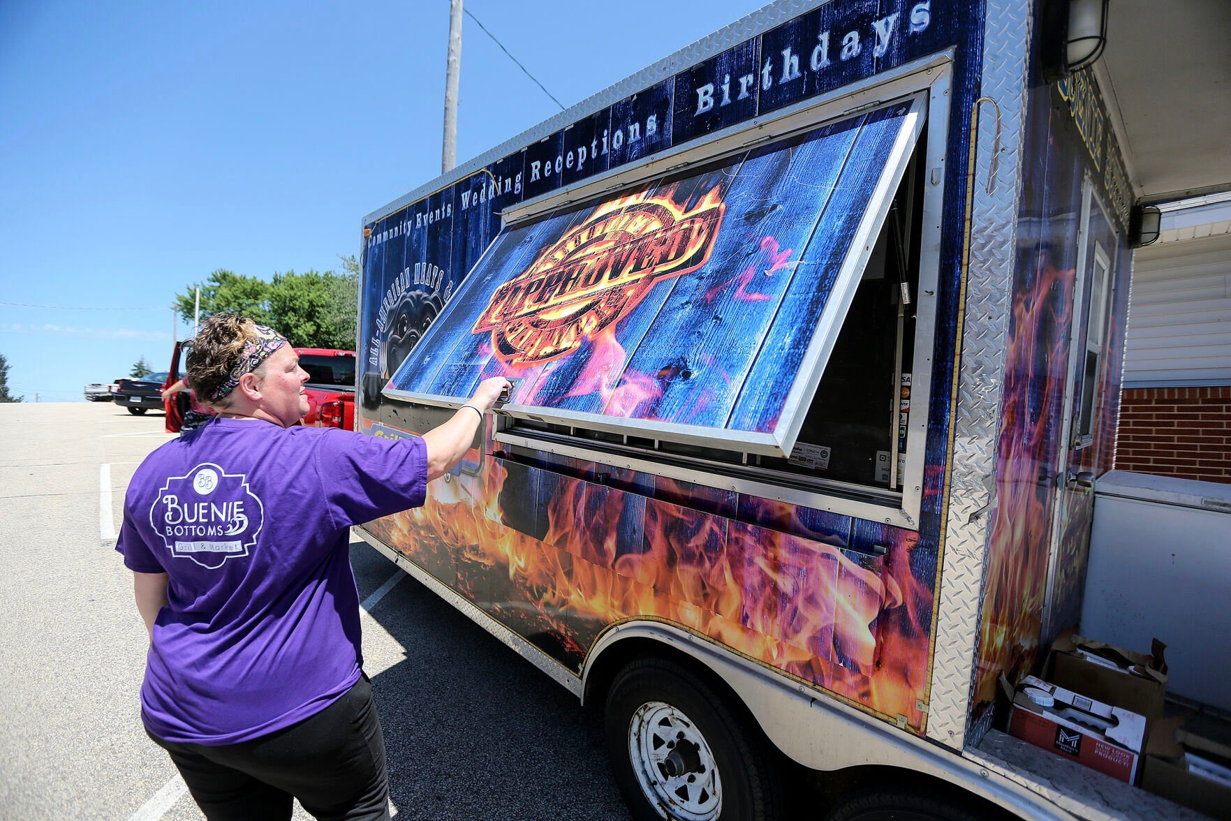 Potter opens up her food truck to start the day.    PHOTO CREDIT: Dave Kettering Telegraph Herald