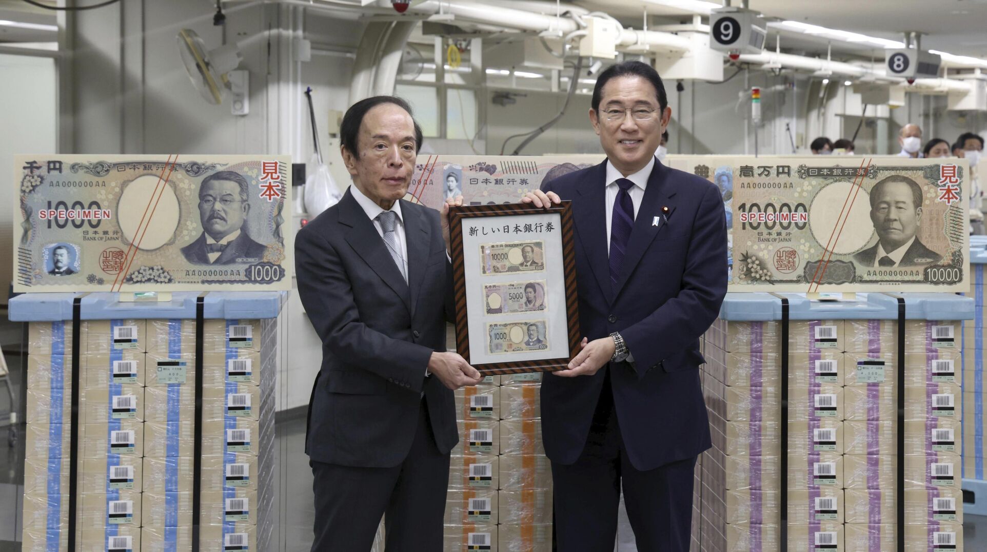 <p>Japanese Prime Minister Fumio Kishida, right, and Bank of Japan Governor Kazuo Ueda hold the country’s new banknotes in a frame, during a ceremony to mark the release of the banknotes, at the BOJ headquarters in Tokyo, Japan, Wednesday, July 3, 2024. (Japan Pool/Kyodo News via AP)</p>   PHOTO CREDIT: Kyodo News via AP