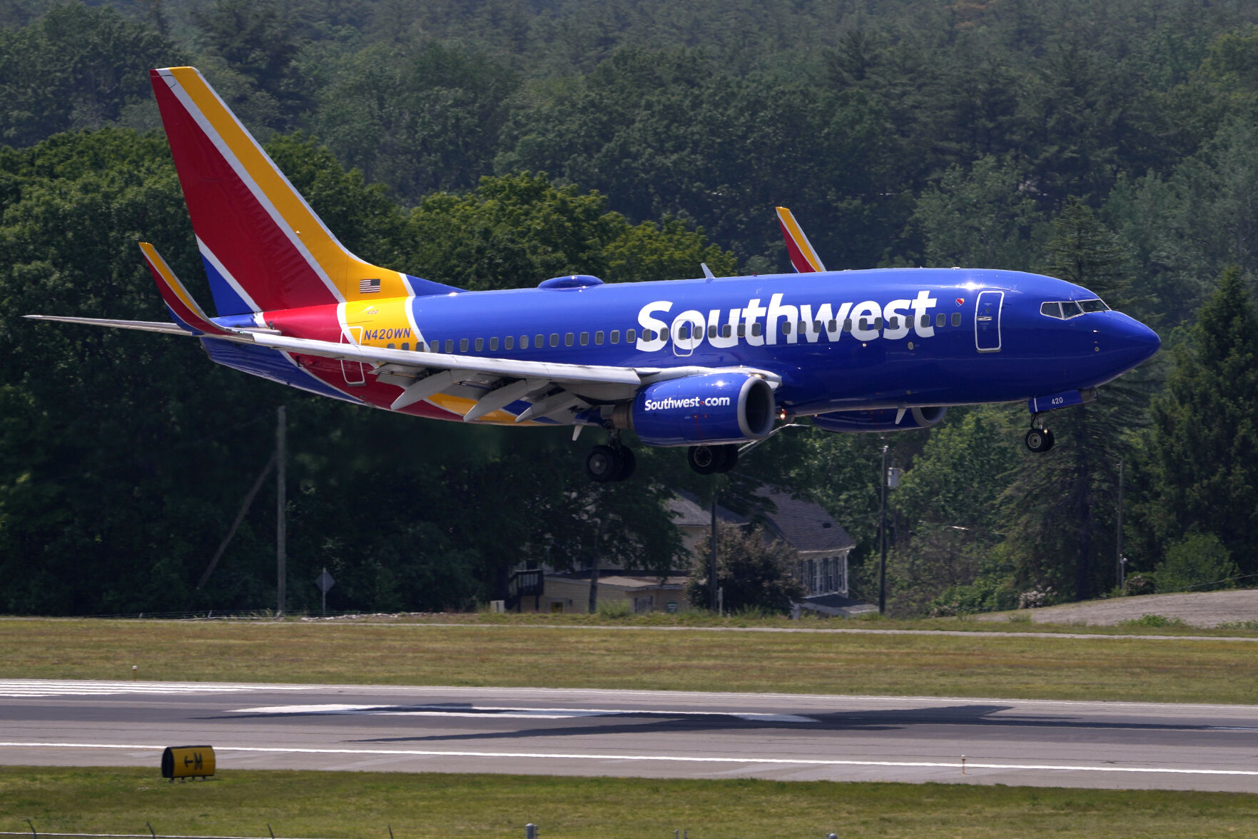 <p>FILE - Southwest Airlines Boeing 737 lands at Manchester Boston Regional Airport, June 2, 2023, in Manchester, N.H. Southwest Airlines has adopted a ‘poison pill’ following activist investor Elliott Investment Management taking a significant stake in the company. The airline said Wednesday, July 3, 2024, that the shareholder rights plan is effective immediately and expires in a year. For any extension to occur, Southwest shareholders would need to give prior approval.(AP Photo/Charles Krupa, File)</p>   PHOTO CREDIT: Charles Krupa 