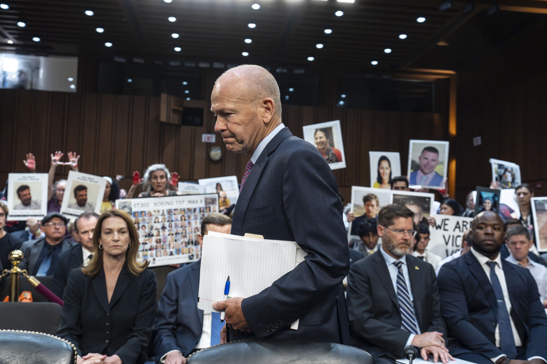 <p>FILE - With protesters in the audience, Boeing CEO Dave Calhoun arrives at a Senate subcommittee hearing to answer to lawmakers about troubles at the aircraft manufacturer. Ike Riffel , a California father whose two sons, died in 2019 when a Boeing 737 Max jetliner crashed in Ethiopia, fears that instead of putting Boeing on trial, the government will offer the company another shot at corporate probation through a legal document called a deferred prosecution agreement, or DPA. (AP Photo/J. Scott Applewhite, File)</p>   PHOTO CREDIT: J. Scott Applewhite 