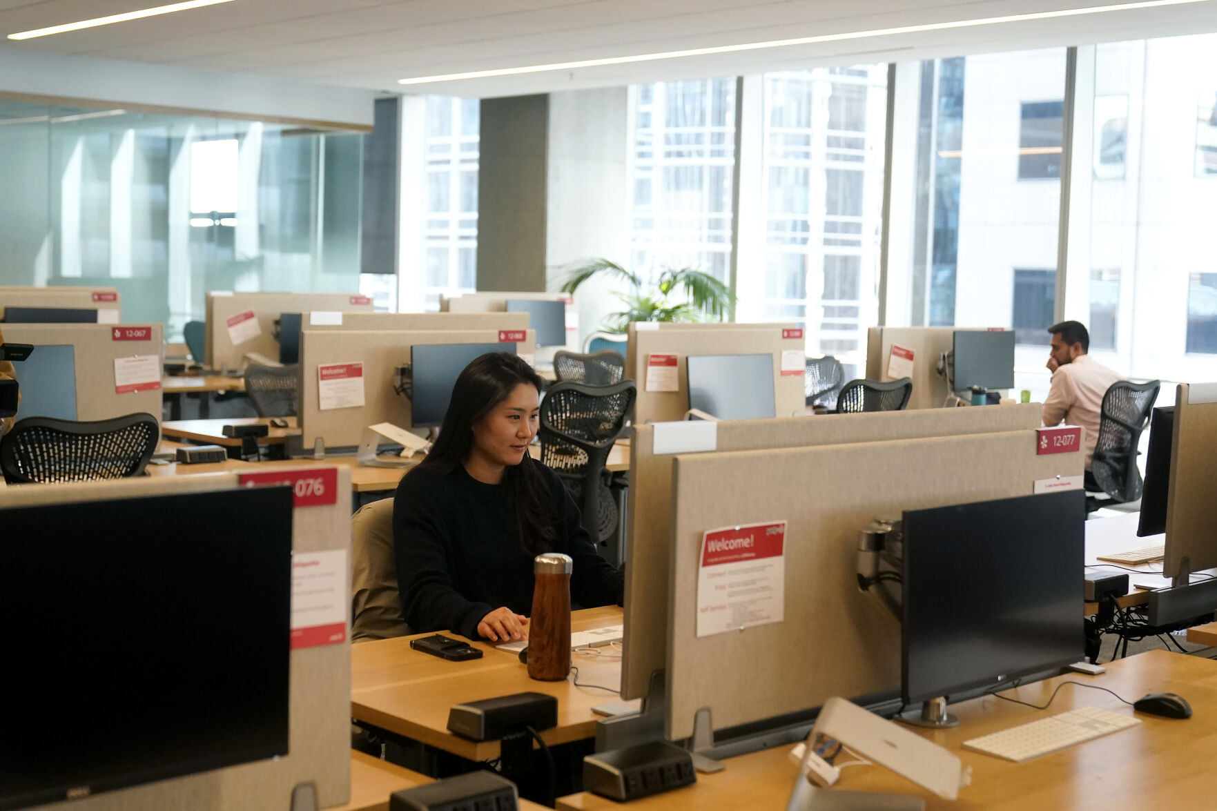 <p>FILE - People work at the Yelp office in San Francisco on Feb. 14, 2023. Remote work has intensified loneliness in the workplace. Experts say friendships and a sense of belonging are vital to employees’ happiness. And also to companies’ success. (AP Photo/Jeff Chiu, File)</p>   PHOTO CREDIT: Jeff Chiu