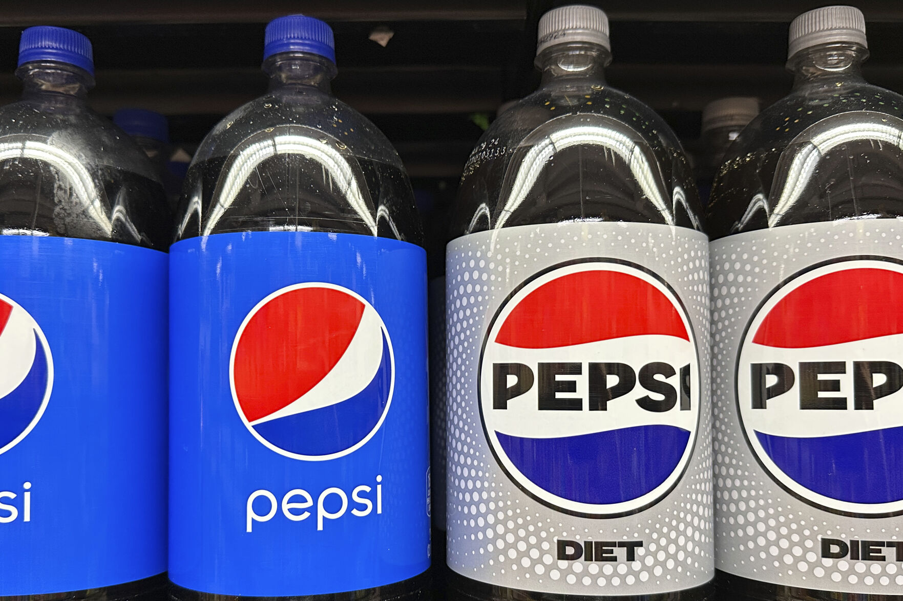 <p>FILE - Plastic bottles of Pepsi are displayed at a grocery store in New York on Nov. 15, 2023. PepsiCo reported second quarter earnings results on Thursday, July 11, 2024. PepsiCo has leaned heavily into price increases over the past two years as its costs for ingredients and packaging rose. The fourth quarter of 2023 was the company’s eighth straight quarter of double-digit percentage price increases. (AP Photo/Ted Shaffrey, File)</p>   PHOTO CREDIT: Ted Shaffrey