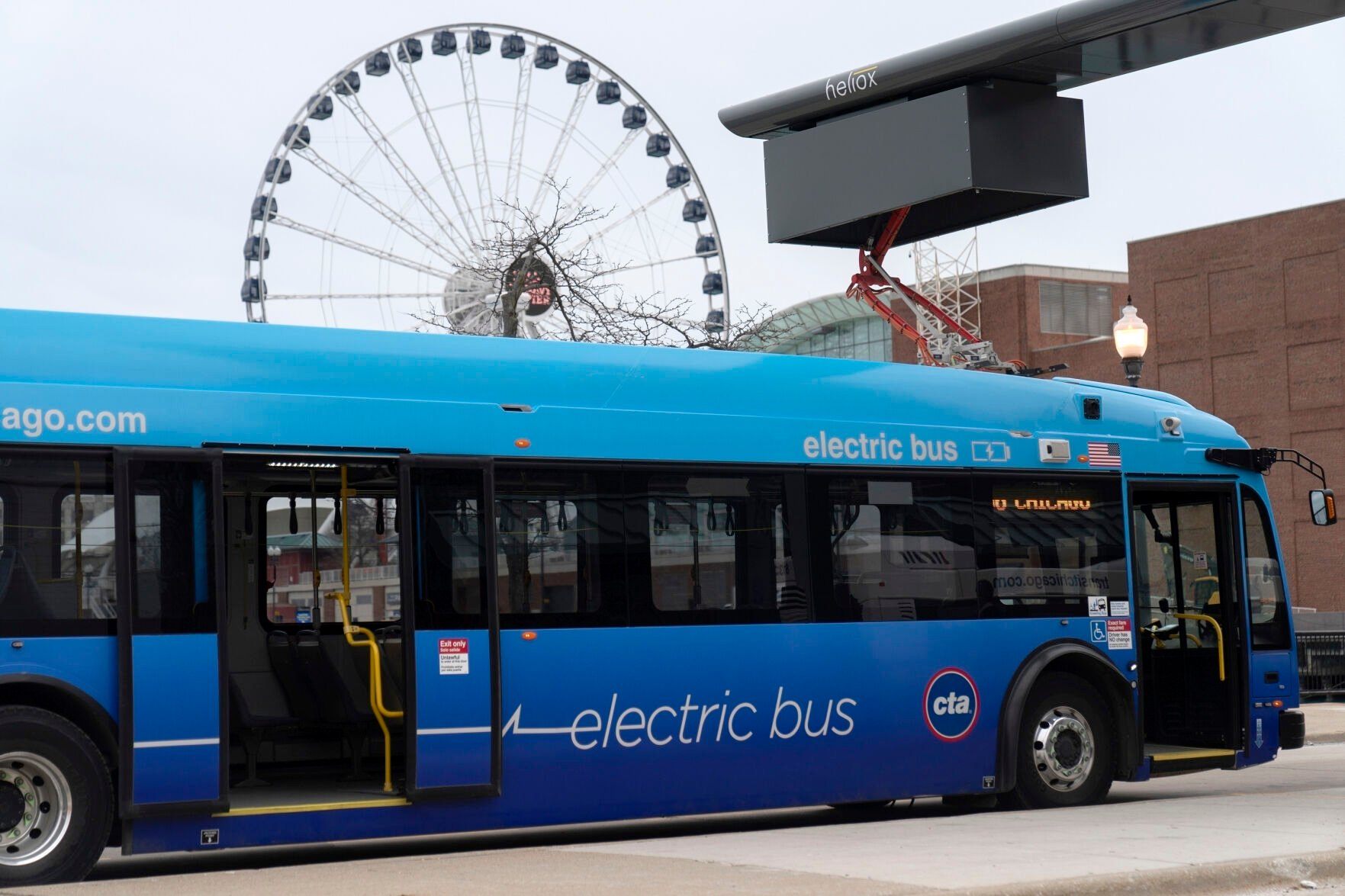 <p>FILE - A Chicago Transit Authority electric bus charges at Navy Pier Tuesday, Feb. 14, 2023, in Chicago. The Biden administration is awarding nearly $2 billion in grants to help restart or expand electric vehicle manufacturing and assembly sites in eight states, including the presidential battlegrounds of Michigan, Pennsylvania and Georgia. Grants totaling $1.7 billion will be issued by the Energy Department to create or retain thousands of union jobs and support auto-based communities that have long driven the U.S. economy, the White House said Thursday, July 11, 2024. (AP Photo/Erin Hooley, File)</p>   PHOTO CREDIT: Erin Hooley