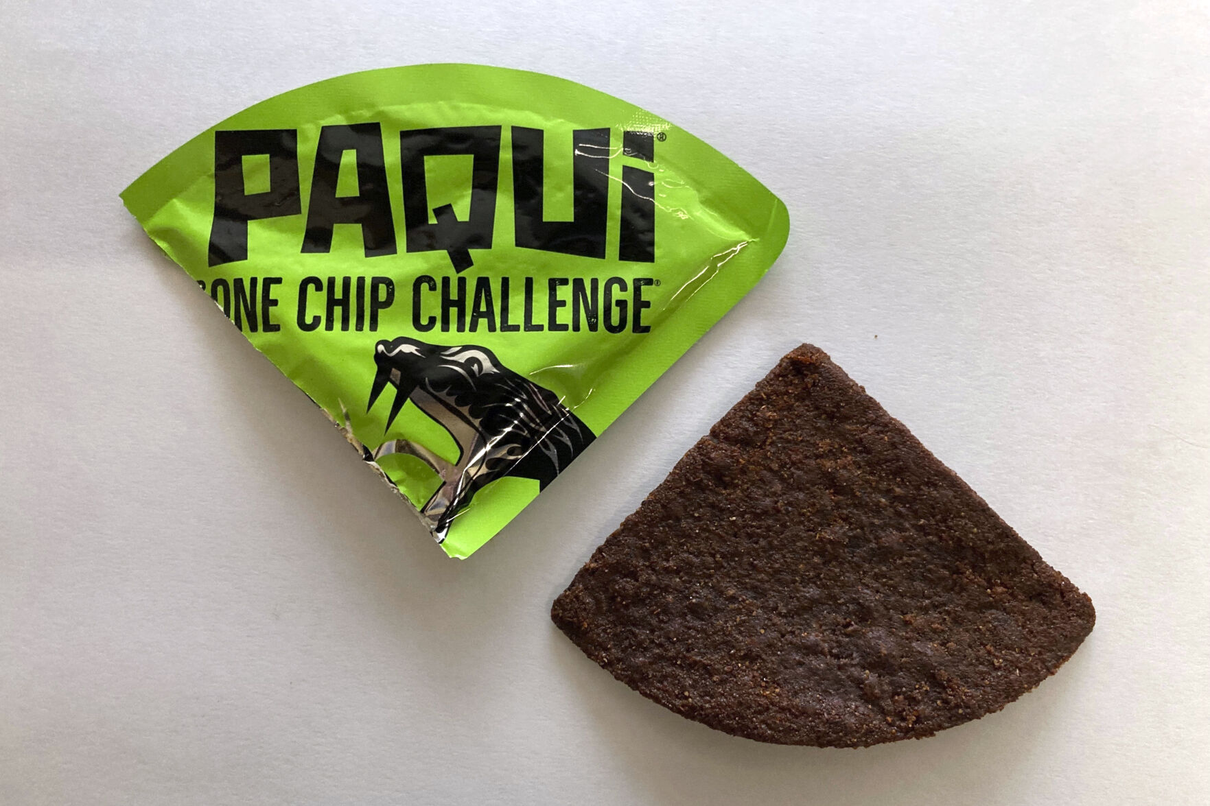 FILE - A Paqui One Chip Challenge chip is displayed in Boston, Friday, Sept. 8, 2023. A lawsuit was filed against a Thursday, July 11, 2024 in the case of a Massachusetts teen who died after he participated in a spicy tortilla chip challenge on social media. (AP Photo/Steve LeBlanc, File)    PHOTO CREDIT: Associated Press