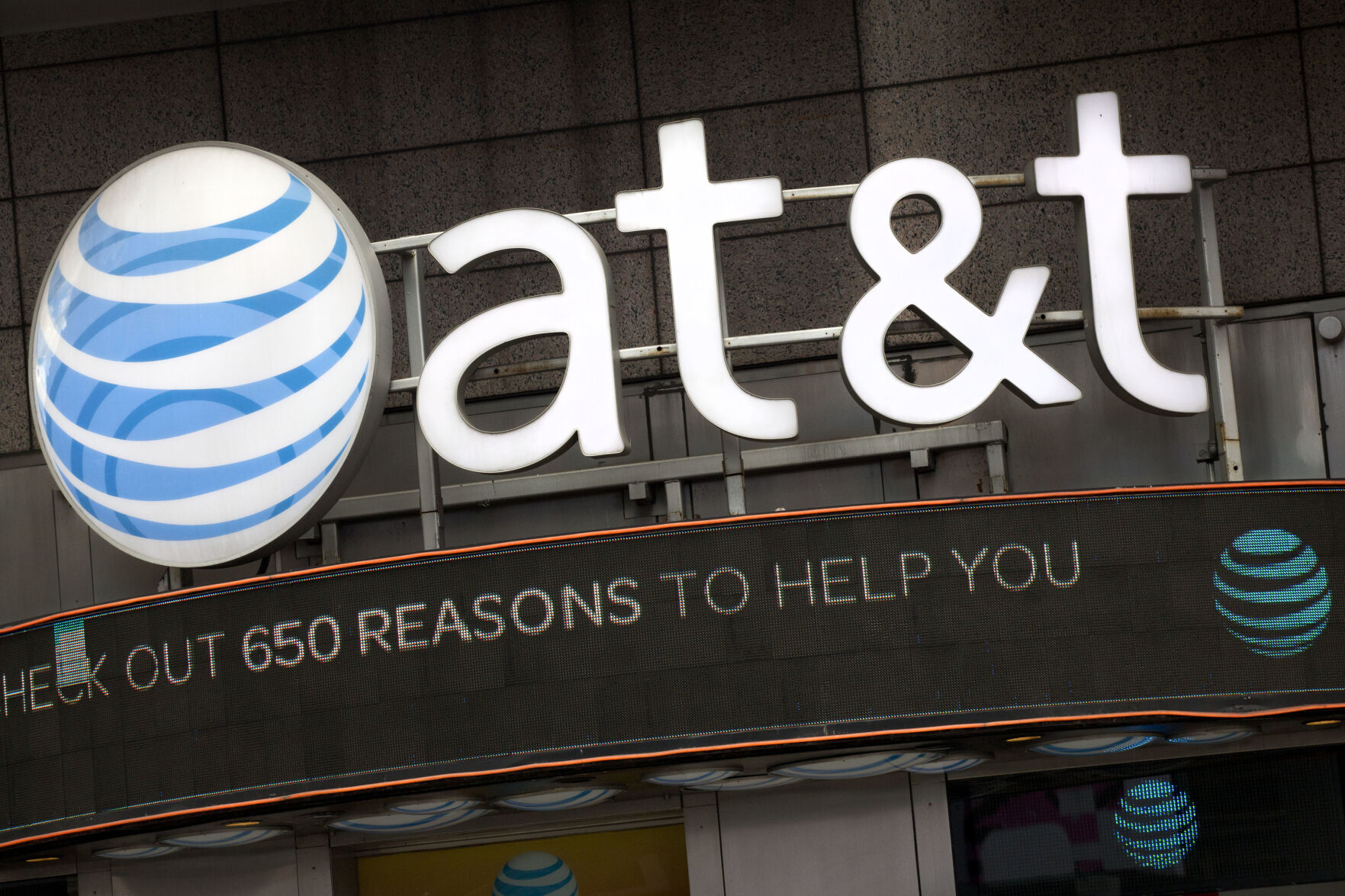 FILE - The AT&T logo is positioned above one of its retail stores in New York, Oct. 24, 2016. A security breach in 2022 compromised the data of nearly all of AT&T’s cellular customers, customers of mobile virtual network operators using AT&T’s wireless network, as well landline customers who interacted with those cellular numbers. The company said Friday, July 23, 2024, that it has launched an investigation and engaged cybersecurity experts to understand the nature and scope of the criminal activity.(AP Photo/Mark Lennihan, File)    PHOTO CREDIT: Associated Press