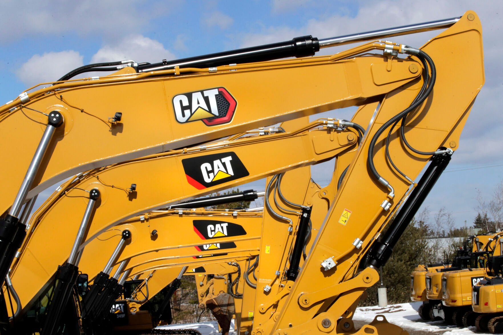 <p>FILE - Excavator booms, adorned with the Caterpillar Inc. "CAT" logo, are displayed at the Milton CAT dealership in Londonderry, N.H., Feb. 20, 2020. On Friday, July 12, 2024, the Labor Department releases producer prices data for June, 2024. (AP Photo/Charles Krupa, File)</p>   PHOTO CREDIT: Charles Krupa - staff, ASSOCIATED PRESS