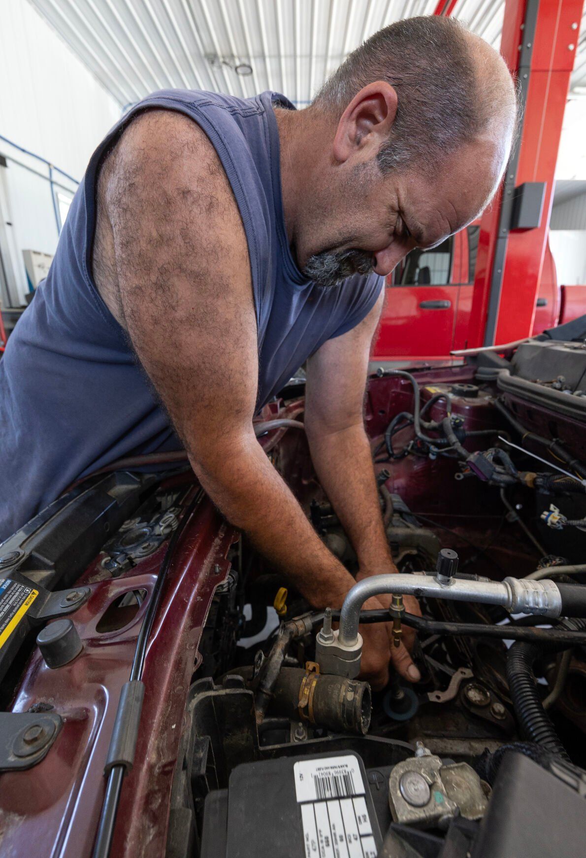 Owner Rick Soppe works on a car at Tri-State Auto Diagnostics in Graf, Iowa, on Friday, July 12, 2024.    PHOTO CREDIT: Stephen Gassman