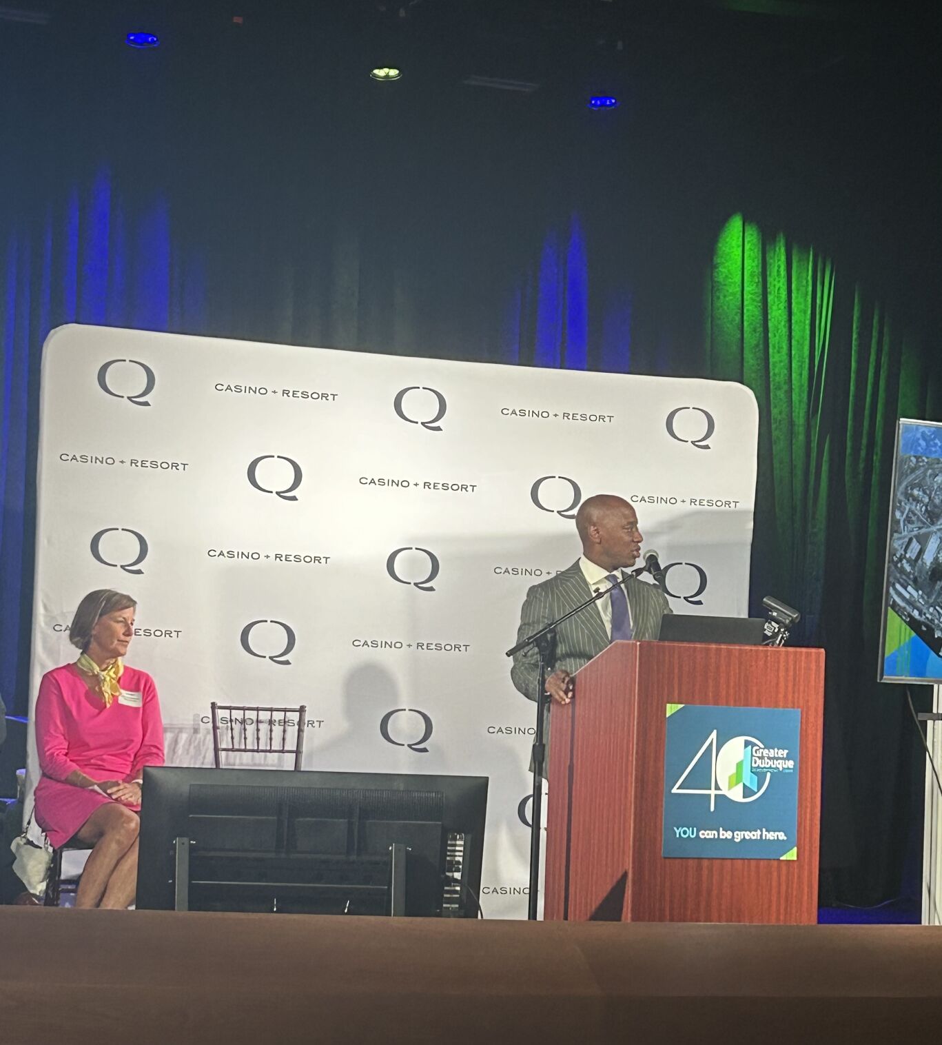 Outgoing board chair Alex Dixon speaks at the annual meeting Wednesday while incoming chair Kay Takes looks on.    PHOTO CREDIT: Konrad Strzalka