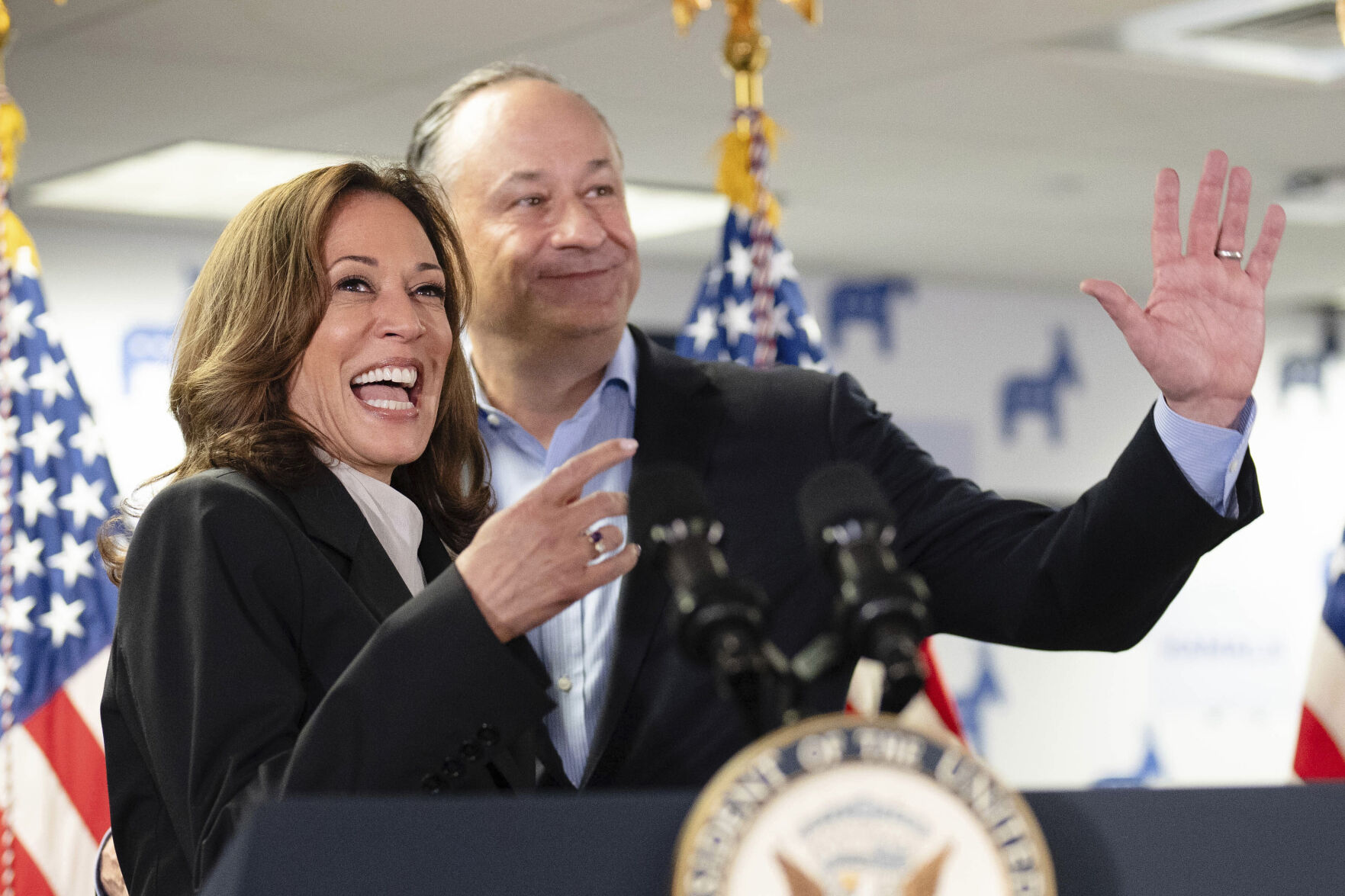 <p>Vice President Kamala Harris, left, and second gentleman Doug Emhoff address staff at her campaign headquarters in Wilmington, Del., Monday, July 22, 2024. (Erin Schaff/The New York Times via AP, Pool)</p>   PHOTO CREDIT: Erin Schaff 