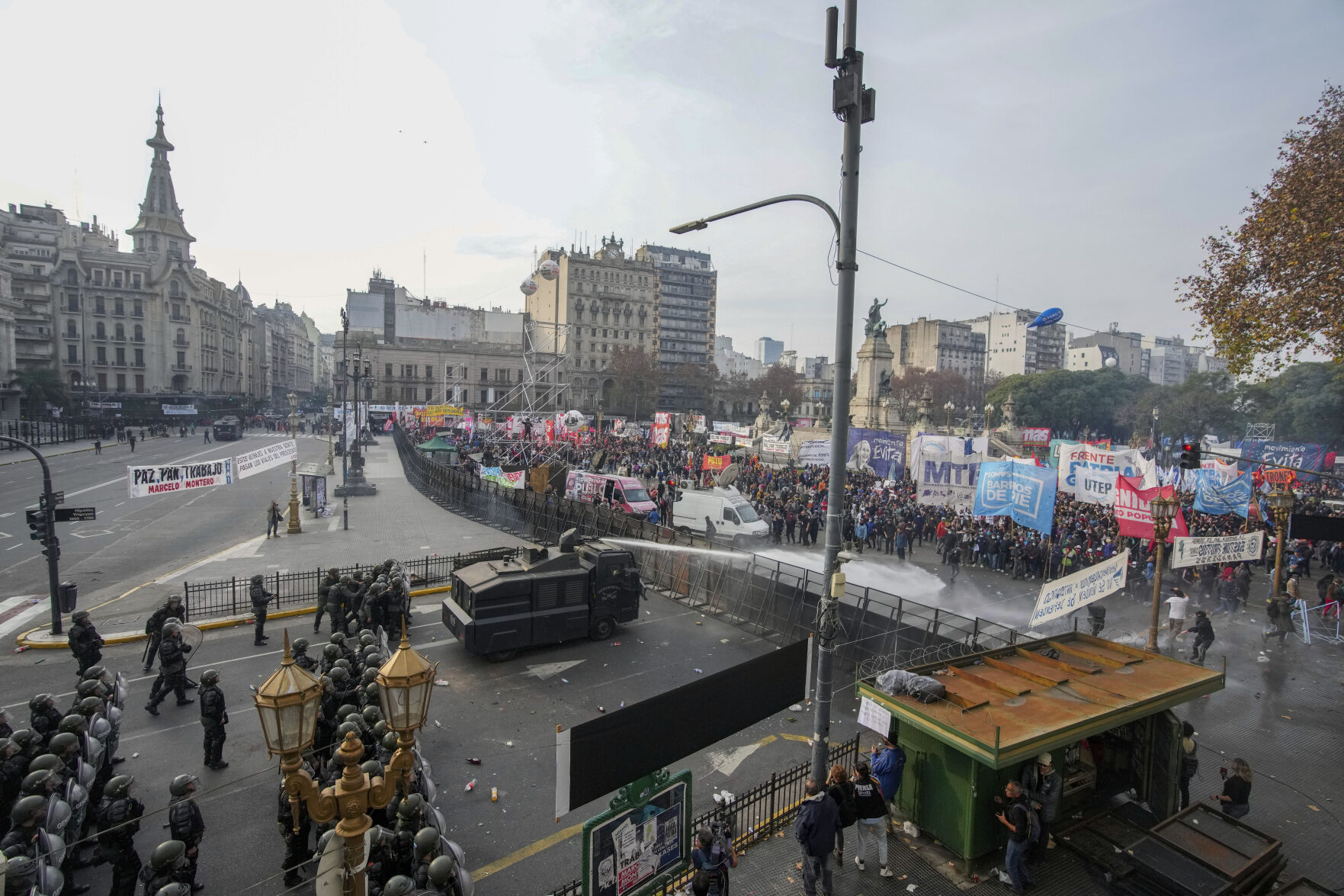 <p>FILE - Police disperse anti-government protesters with water canons outside Congress, as lawmakers debate a reform bill of austerity measures promoted by Argentine President Javier Milei in Buenos Aires, Argentina, June 12, 2024. Milei scrapped price controls and slashed subsidies, causing prices to skyrocket in a country that already had among the world’s highest inflation rates. (AP Photo/Natacha Pisarenko, File)</p>   PHOTO CREDIT: Natacha Pisarenko 