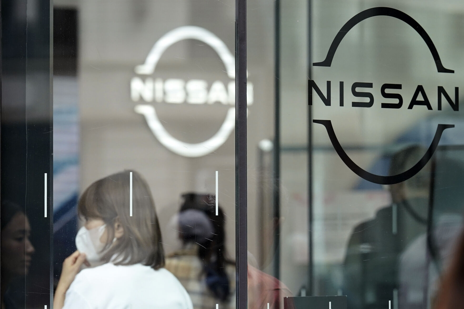 <p>FILE - Logos at a Nissan showroom are seen in Ginza shopping district in Tokyo, March 31, 2023. (AP Photo/Eugene Hoshiko, File)</p>   PHOTO CREDIT: Eugene Hoshiko