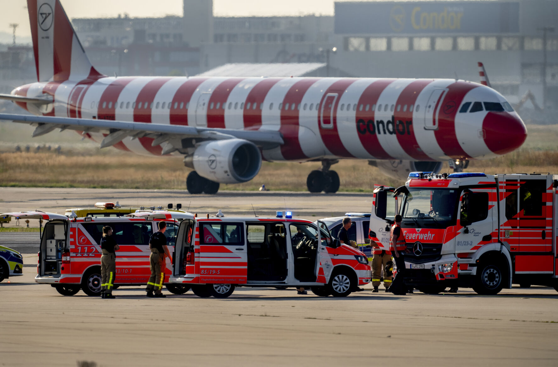 <p>Emergency vehicles stand on a runway at the airport in Frankfurt, Germany, Thursday, July 25, 2024, after a few climate activists glued themselves to the ground blocking air traffic for several hours. (AP Photo/Michael Probst)</p>   PHOTO CREDIT: Michael Probst - staff, ASSOCIATED PRESS