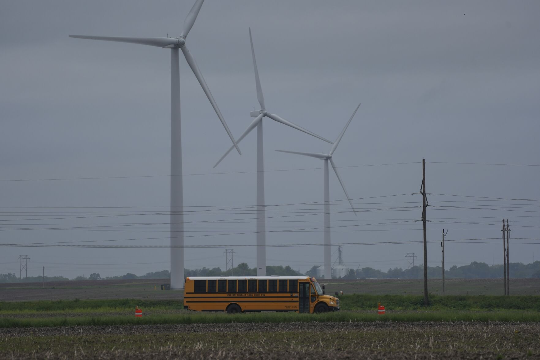 <p>A school bus drives down a road near a field of wind turbines, Thursday, May 9, 2024, in Paxton, Ill. (AP Photo/Joshua A. Bickel)</p>   PHOTO CREDIT: Joshua A. Bickel 