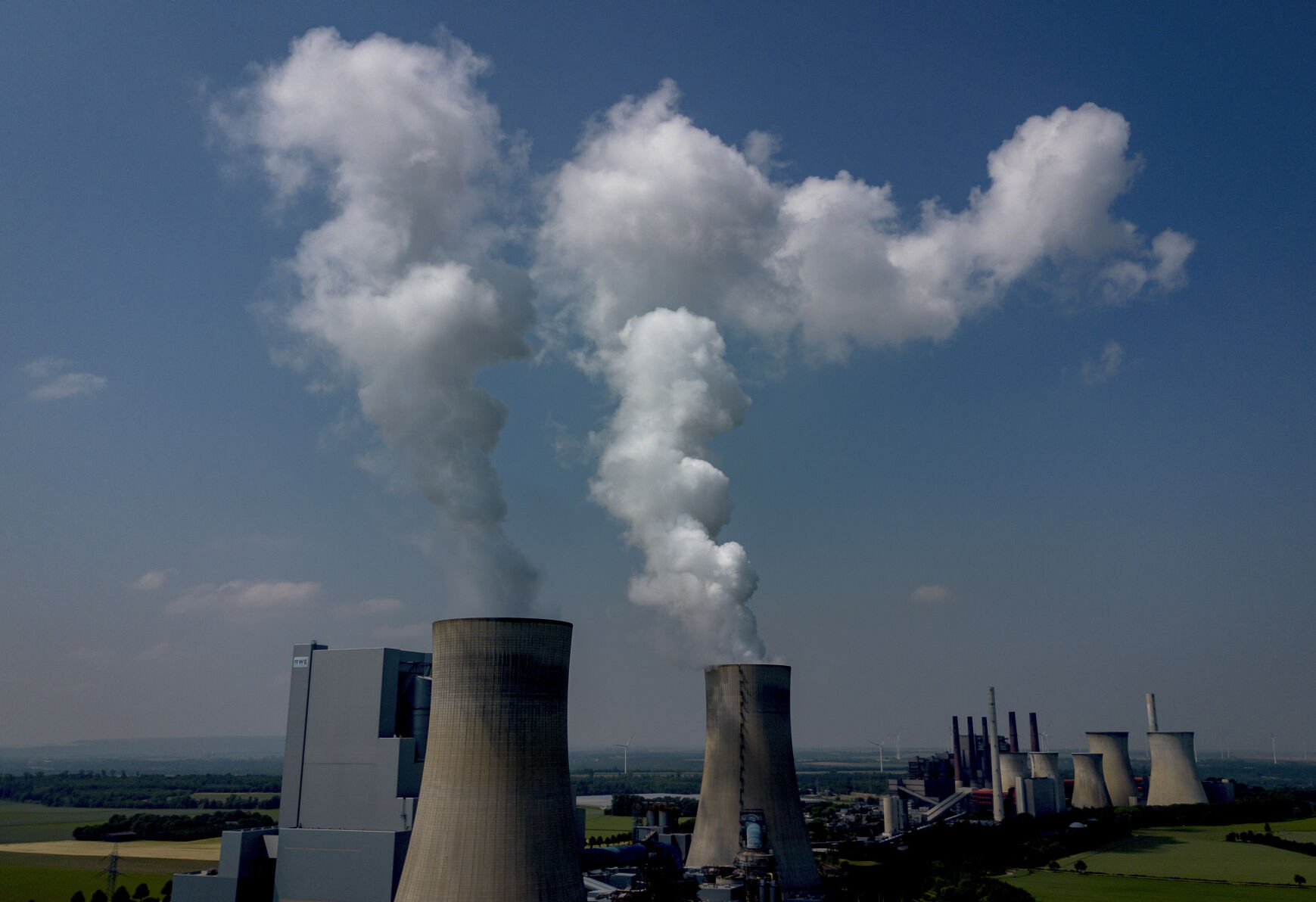 FILE - Steam rises from the coal-fired power plant in Neurath, Germany, on June 8, 2023. European Union statistics agency Eurostat releases official figures Tuesday on second-quarter economic growth (AP Photo/Michael Probst, File)    PHOTO CREDIT: Associated Press