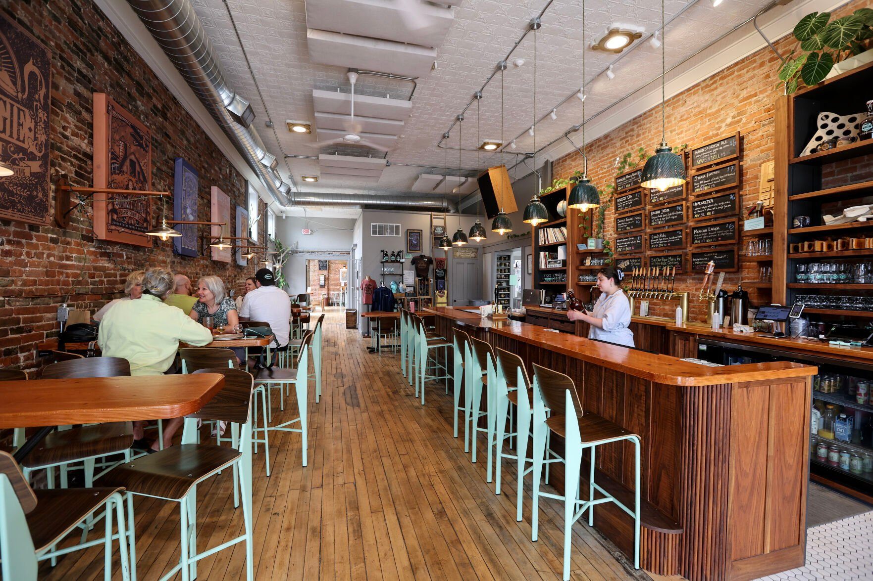 People chat inside Jubeck New World Brewing.    PHOTO CREDIT: Dave Kettering