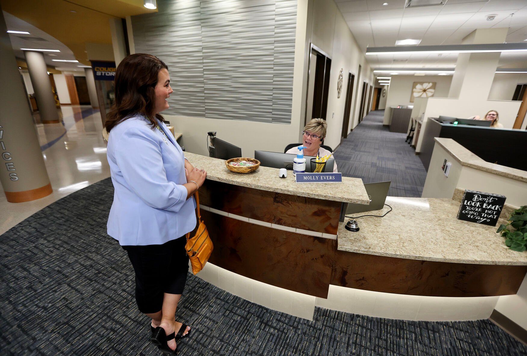 Amy Lasack talks with Molly Evers at the NICC Peosta campus.    PHOTO CREDIT: Dave Kettering