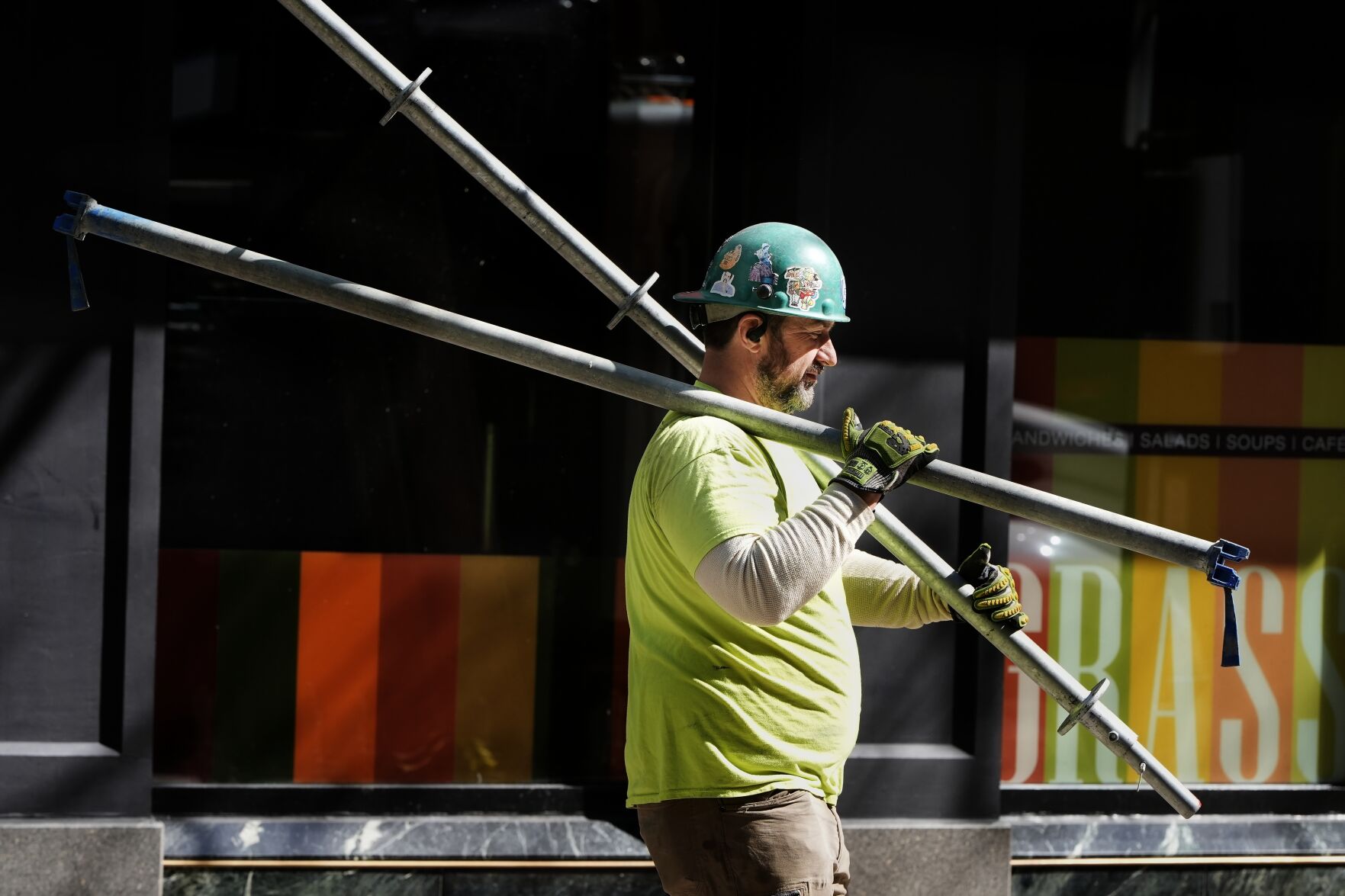 <p>FILE - A construction worker carries scaffolding parts on March 14, 2024, in Boston. On Friday, August 2, 2024, the U.S. government issues its July jobs report. (AP Photo/Michael Dwyer, File)</p>   PHOTO CREDIT: Michael Dwyer - staff, ASSOCIATED PRESS