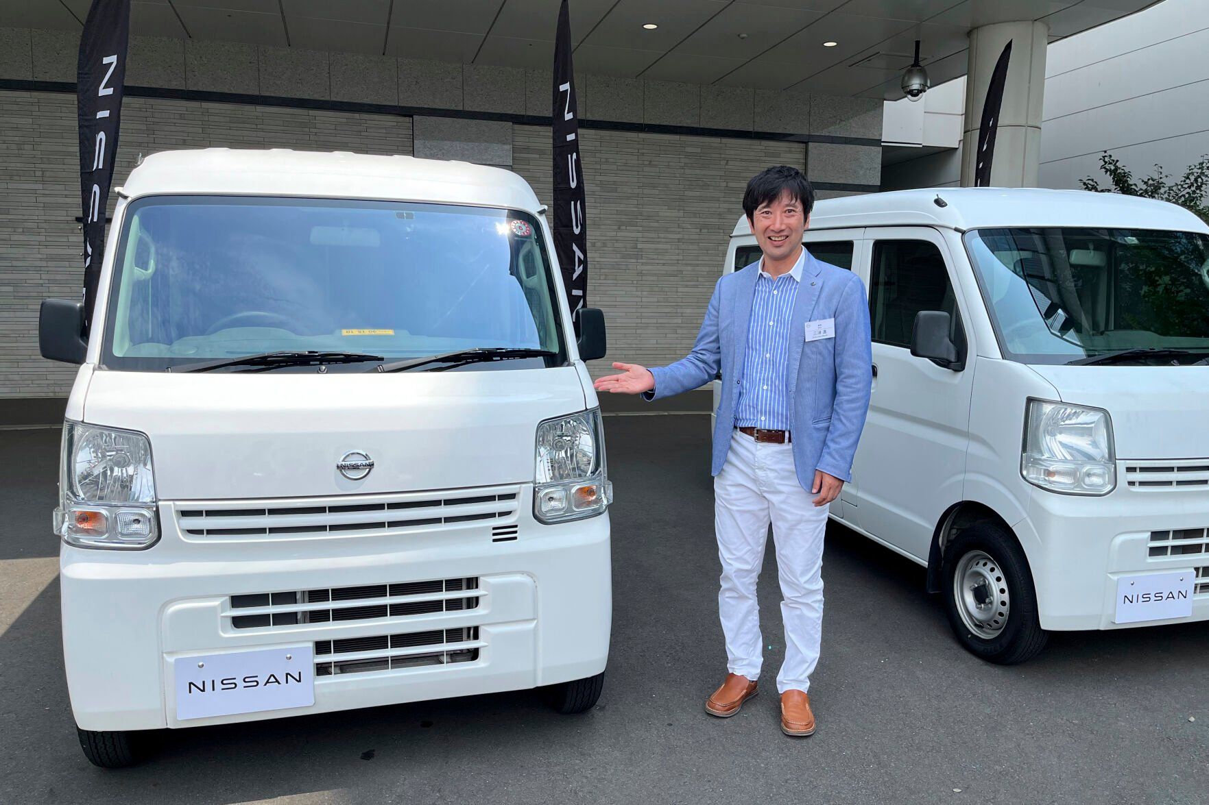 <p>Susumu Miura, a Nissan Research Center manager, shows a Nissan car that is coated with the special “cool paint,” under testing at Tokyo’s Haneda airport Tuesday, Aug. 6, 2024. (AP Photo/Yuri Kageyama)</p>   PHOTO CREDIT: Yuri Kageyama 