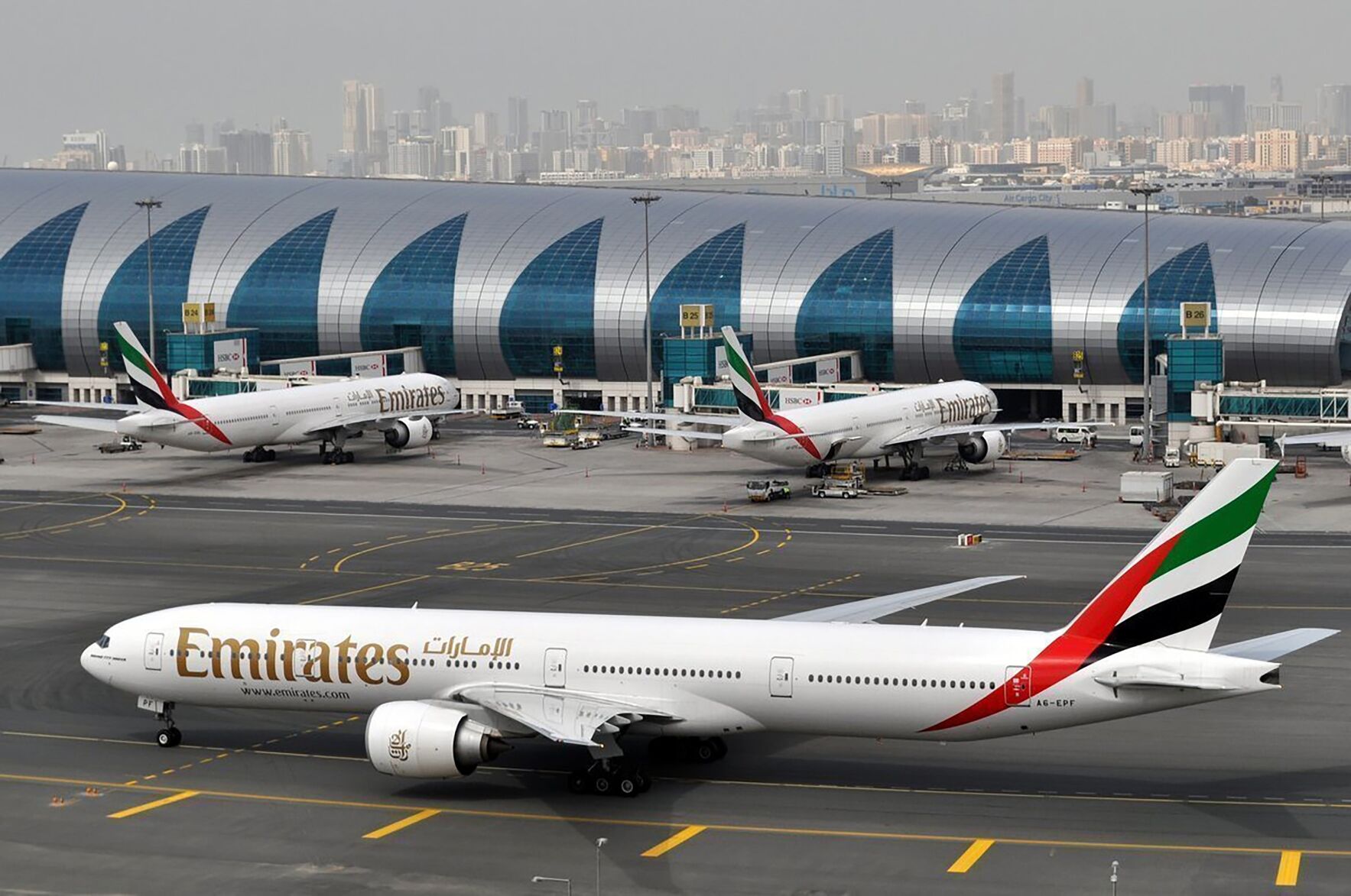 <p>FILE - An Emirates plane taxis to a gate at Dubai International Airport at Dubai International Airport in Dubai, United Arab Emirates, March 22, 2017. (AP Photo/Adam Schreck, File)</p>   PHOTO CREDIT: Adam Scheck 