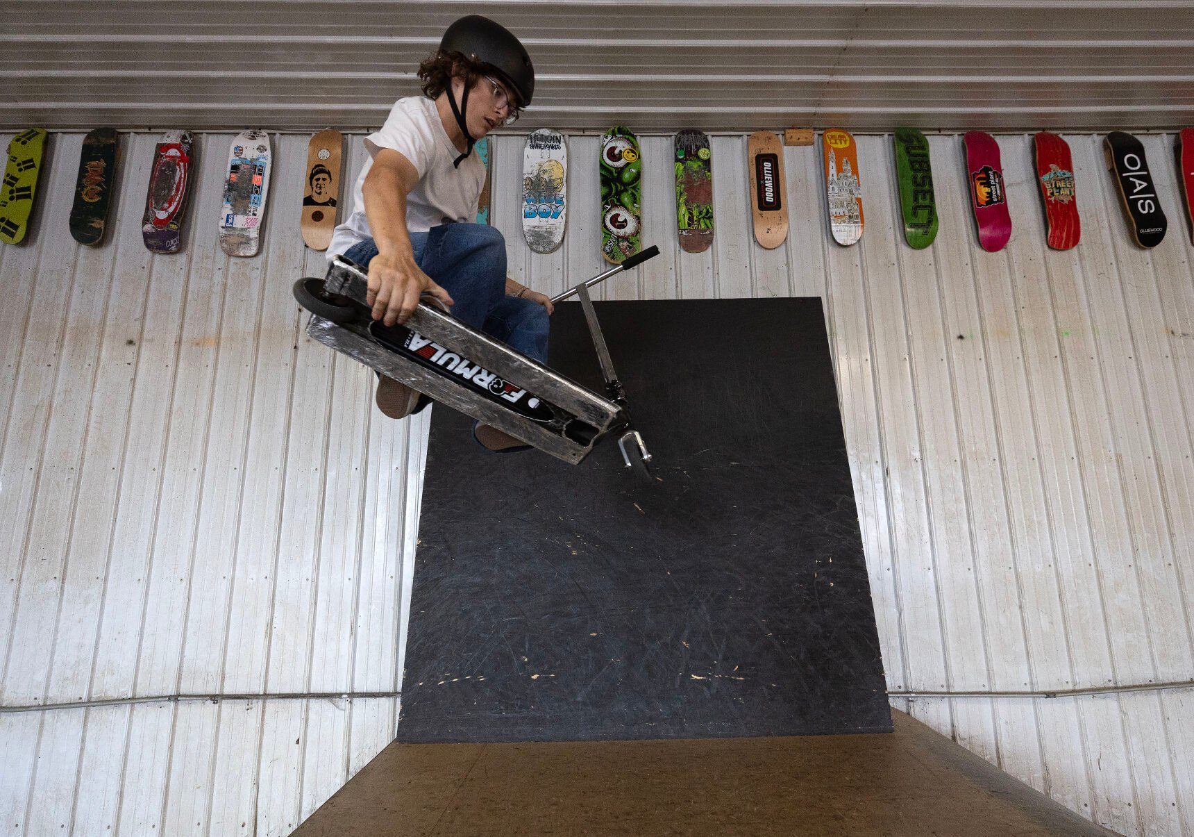 Korbin Valentine, 15, rides his scooter at Olliewood Action Sports in Dubuque last week.    PHOTO CREDIT: Stephen Gassman