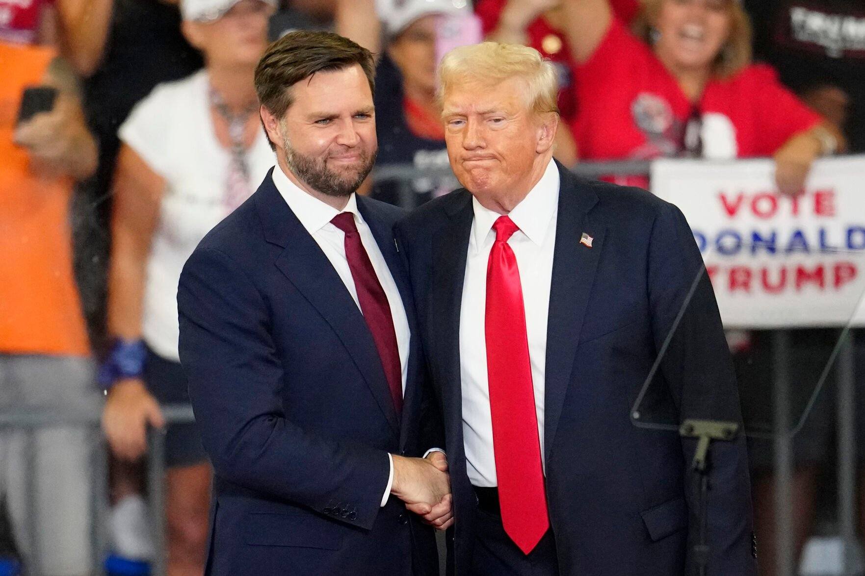 <p>FILE - Republican vice presidential candidate Sen. JD Vance, R-Ohio, left, and Republican presidential candidate former President Donald Trump, shake hands at a campaign rally in Atlanta, Aug. 3, 2024. (AP Photo/Ben Gray, File)</p>   PHOTO CREDIT: Ben Gray 