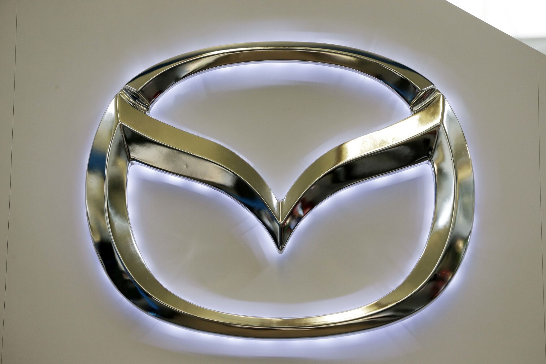 <p>FILE - This Feb. 14, 2013, file photo, shows the Mazda logo on a sign at the 2013 Pittsburgh Auto Show, in Pittsburgh. (AP Photo/Gene J. Puskar, File)</p>   PHOTO CREDIT: Gene J. Puskar 