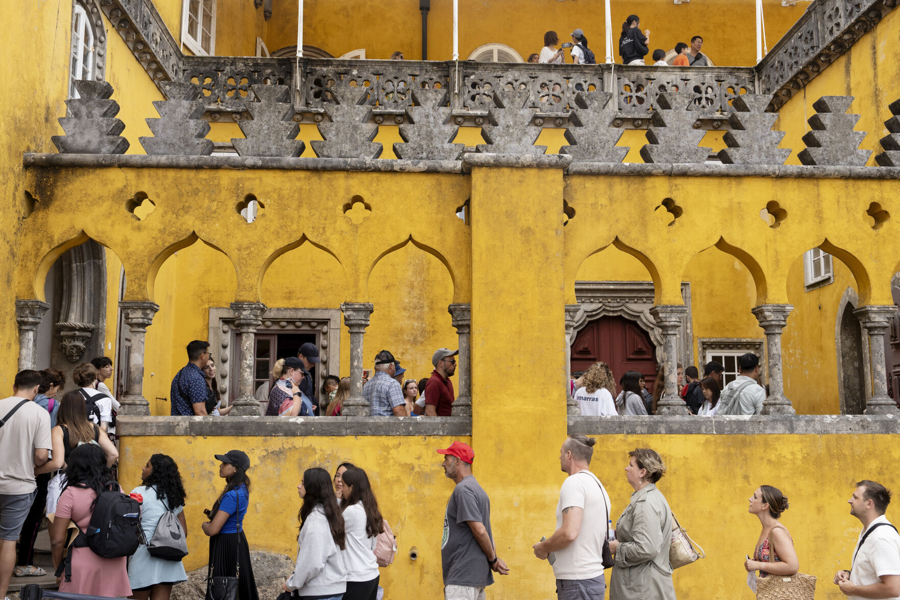 <p>Tourists queue to visit the interior of the 19th century Pena Palace in Sintra, Portugal, Wednesday, Aug. 14, 2024. (AP Photo/Ana Brigida)</p>   PHOTO CREDIT: Ana Brigida