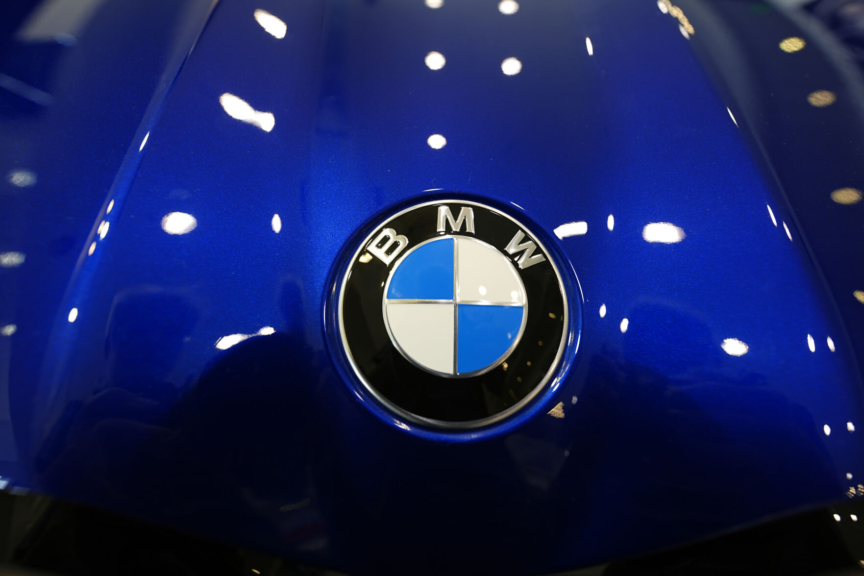 <p>FILE - The company logo shines on the hood of an unsold vehicle at a Mini Honda BMW dealership on July 22, 2024, in Highlands Ranch, Colo. (AP Photo/David Zalubowski, File)</p>   PHOTO CREDIT: David Zalubowski 