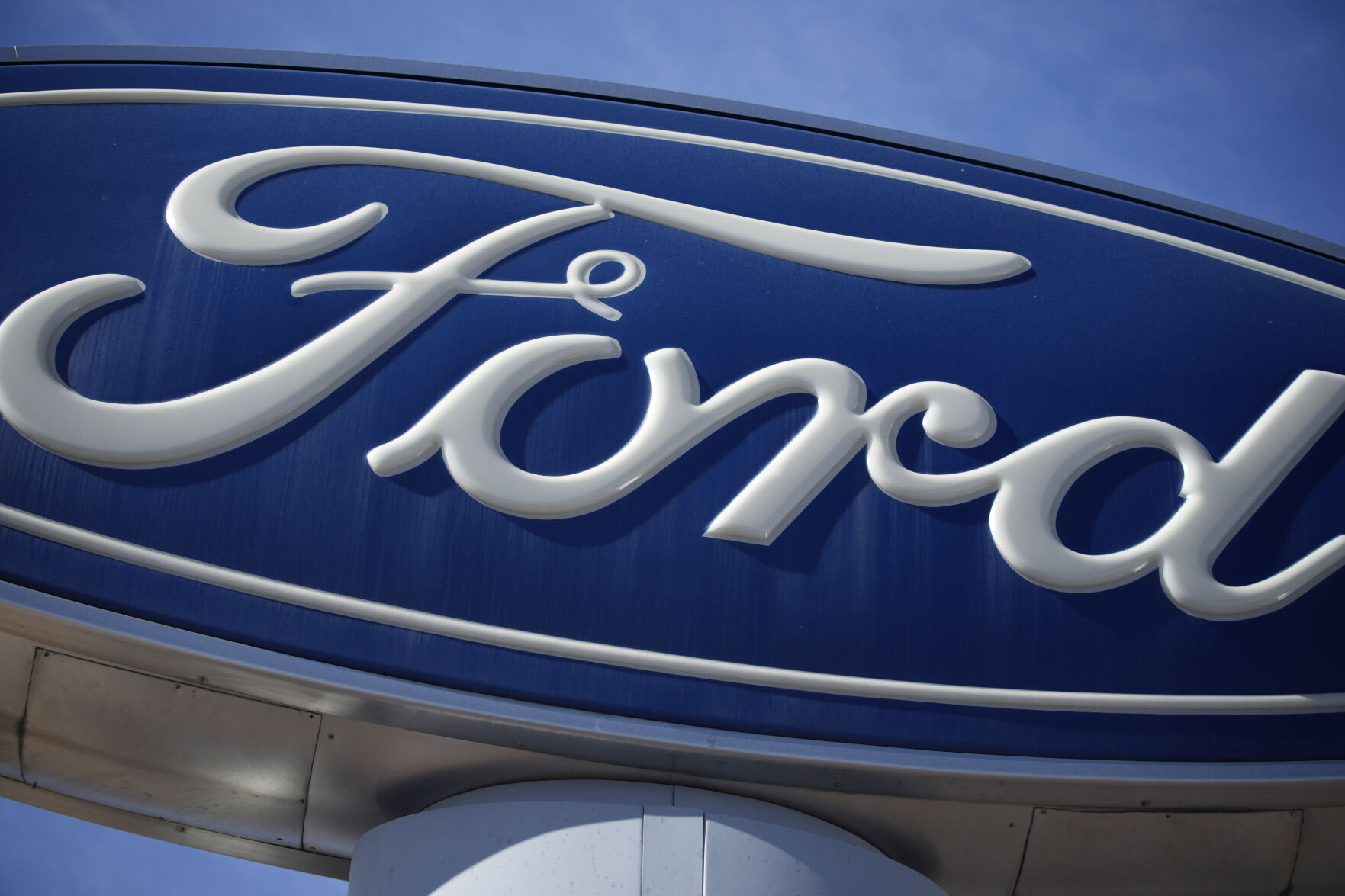 <p>FILE - A Ford company logo on a sign at a Ford dealership in southeast Denver, Oct. 24, 2021. (AP Photo/David Zalubowski, File)</p>   PHOTO CREDIT: David Zalubowski 