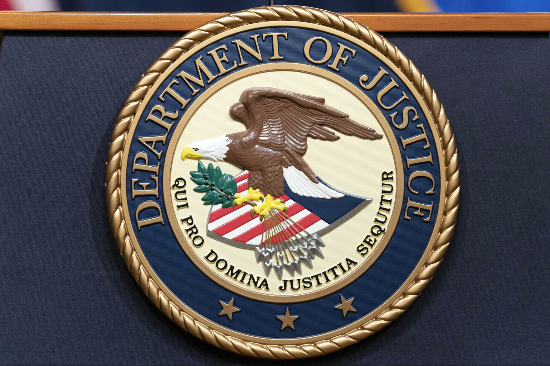 FILE - The Department of Justice seals is seen during a news conference at the DOJ office in Washington, May 16, 2023. (AP Photo/Jose Luis Magana, File)    PHOTO CREDIT: Associated Press