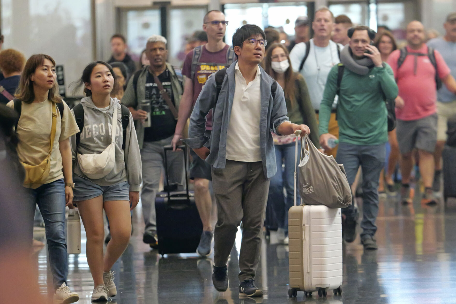 <p>FILE - Travelers pass through Salt Lake City International Airport on July 3, 2024, in Salt Lake City. (AP Photo/Rick Bowmer, File)</p>   PHOTO CREDIT: Rick Bowmer - staff, ASSOCIATED PRESS