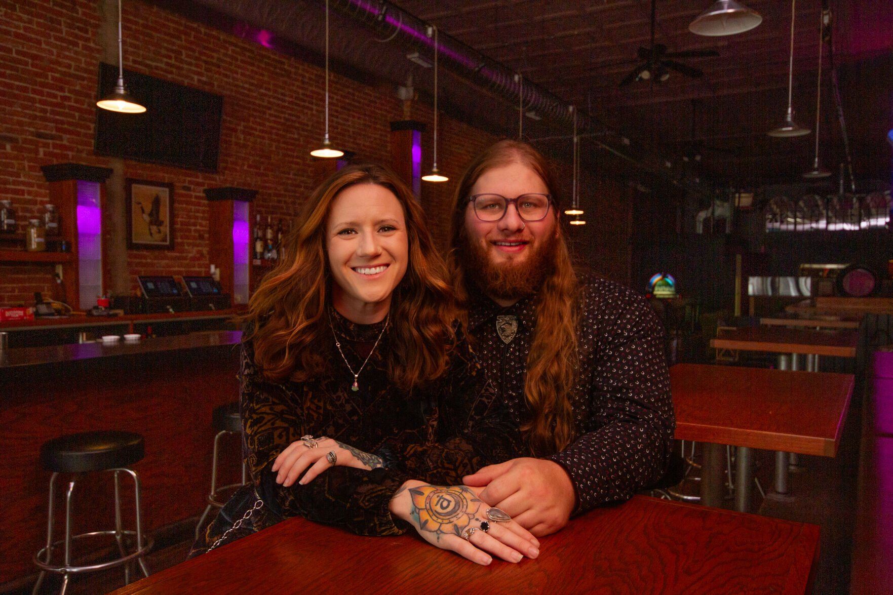 Co-owners Natalie Heck and Noah Riley sit inside The Goose, a music lounge that opened recently at 920 Main St. in Dubuque. The business includes a music venue, yoga studio and bar.    PHOTO CREDIT: Contributed