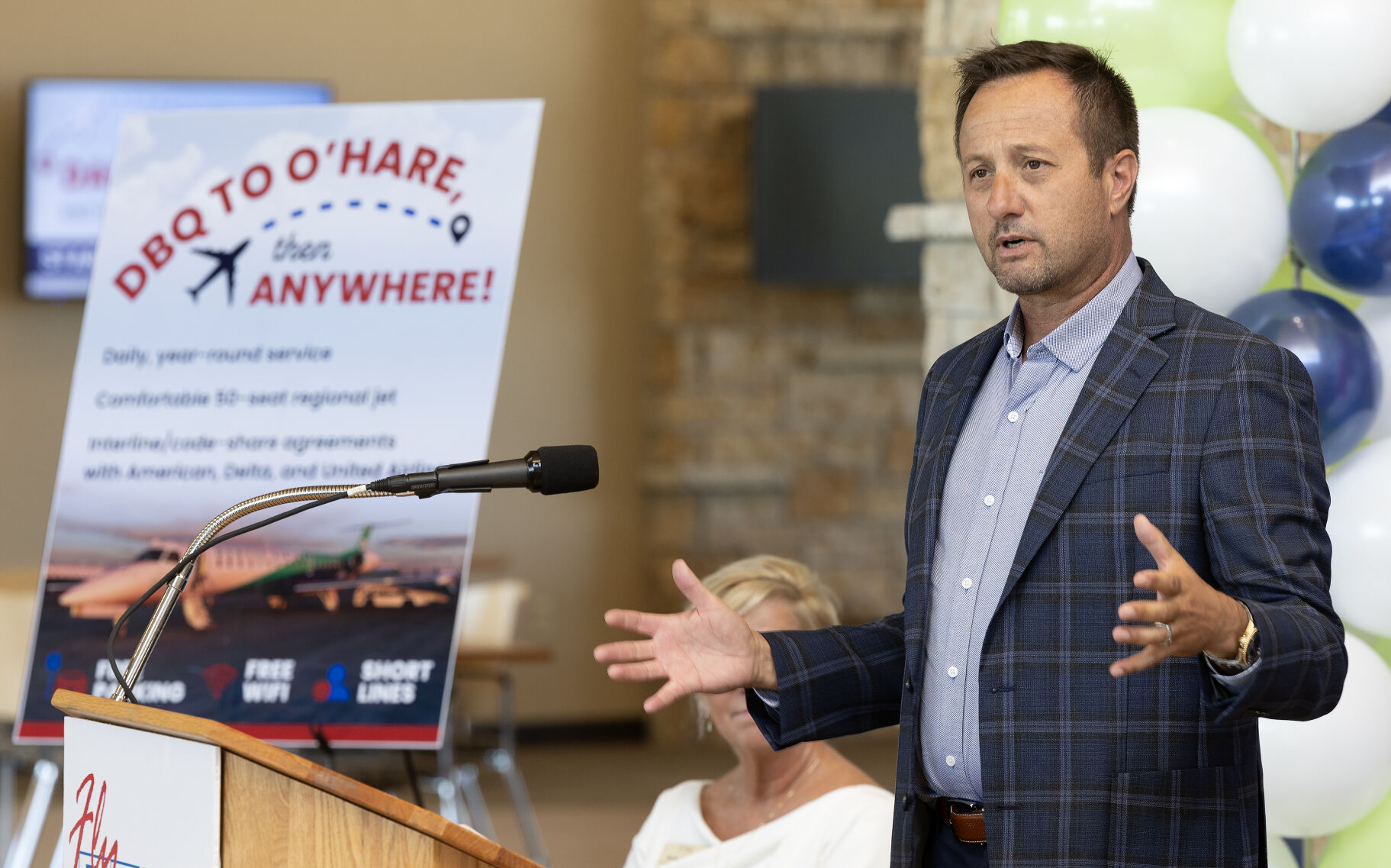 Jon Coleman, senior vice president of corporate strategy/airline pilot with Denver Air Connection, speaks during the announcement of the return of daily passenger air service at Dubuque Regional Airport on Tuesday, Aug. 27, 2024.    PHOTO CREDIT: Stephen Gassman