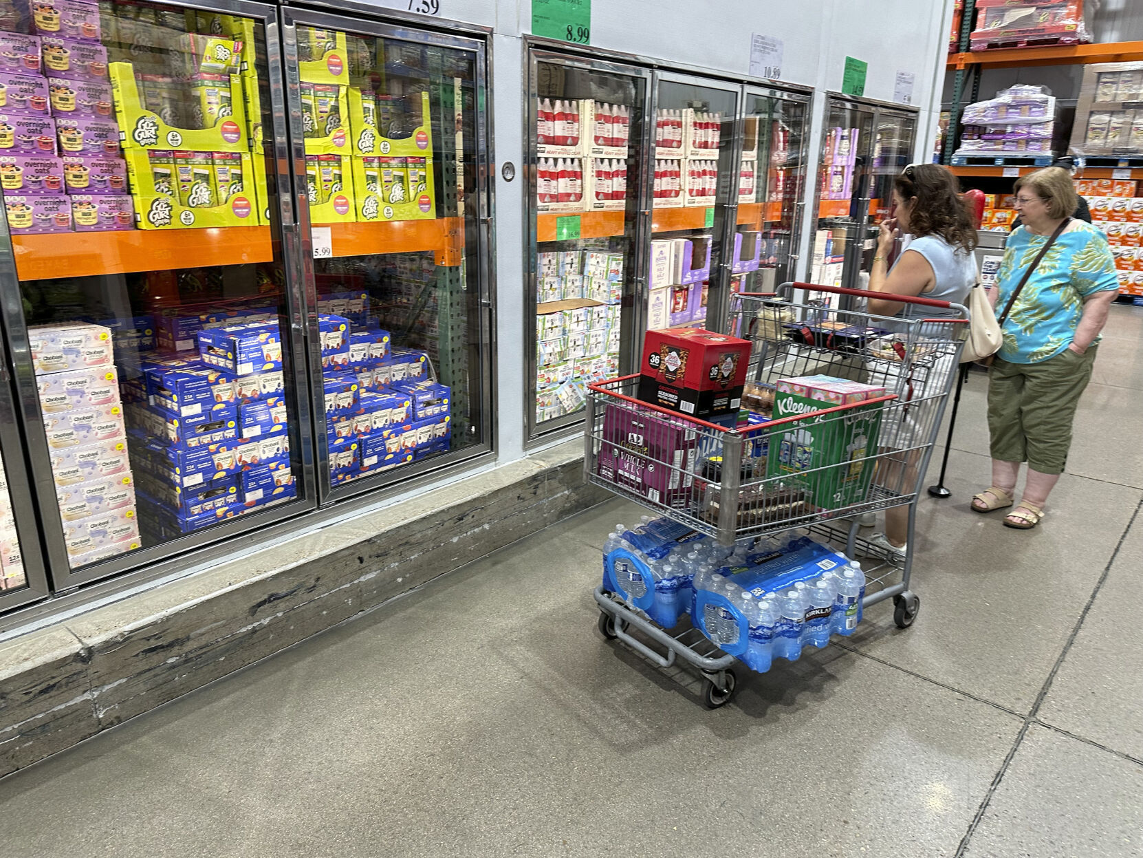 <p>Shoppers consider items displayed in refrigerators at a Costco warehouse Aug. 22, 2024, in Parker, Colo. (AP Photo/David Zalubowski)</p>   PHOTO CREDIT: David Zalubowski - staff, ASSOCIATED PRESS