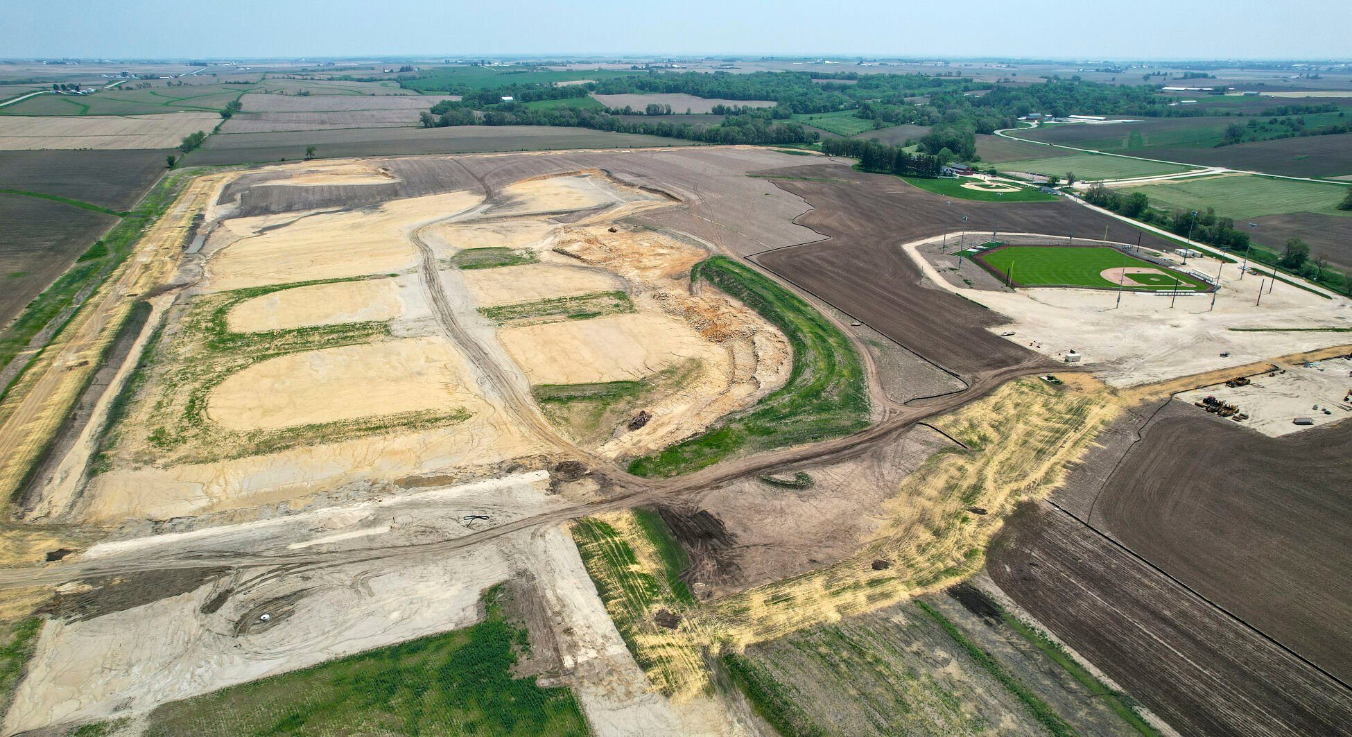 Project Heaven construction (left) was occurring at the Field of Dreams in Dyersville, Iowa, last year. The Field of Dreams site was sold to a local nonprofit group earlier this week.    PHOTO CREDIT: Dave Kettering, Telegraph Herald file