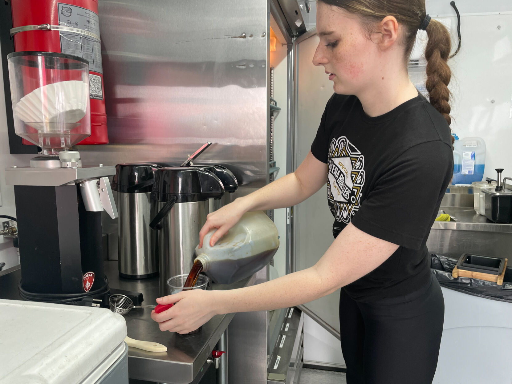 Sydney Hall prepares a customer’s order in the Galena Roasters coffee truck at The Galena Territory Farmers Market.    PHOTO CREDIT: Elizabeth Kelsey
Telegraph Herald