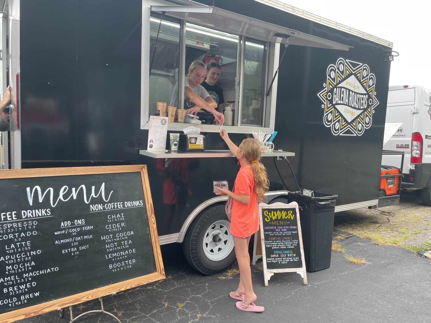 A young customer places her order at the Galena Roasters coffee truck at The Galena Territory Farmers Market.    PHOTO CREDIT: Elizabeth Kelsey
Telegraph Herald