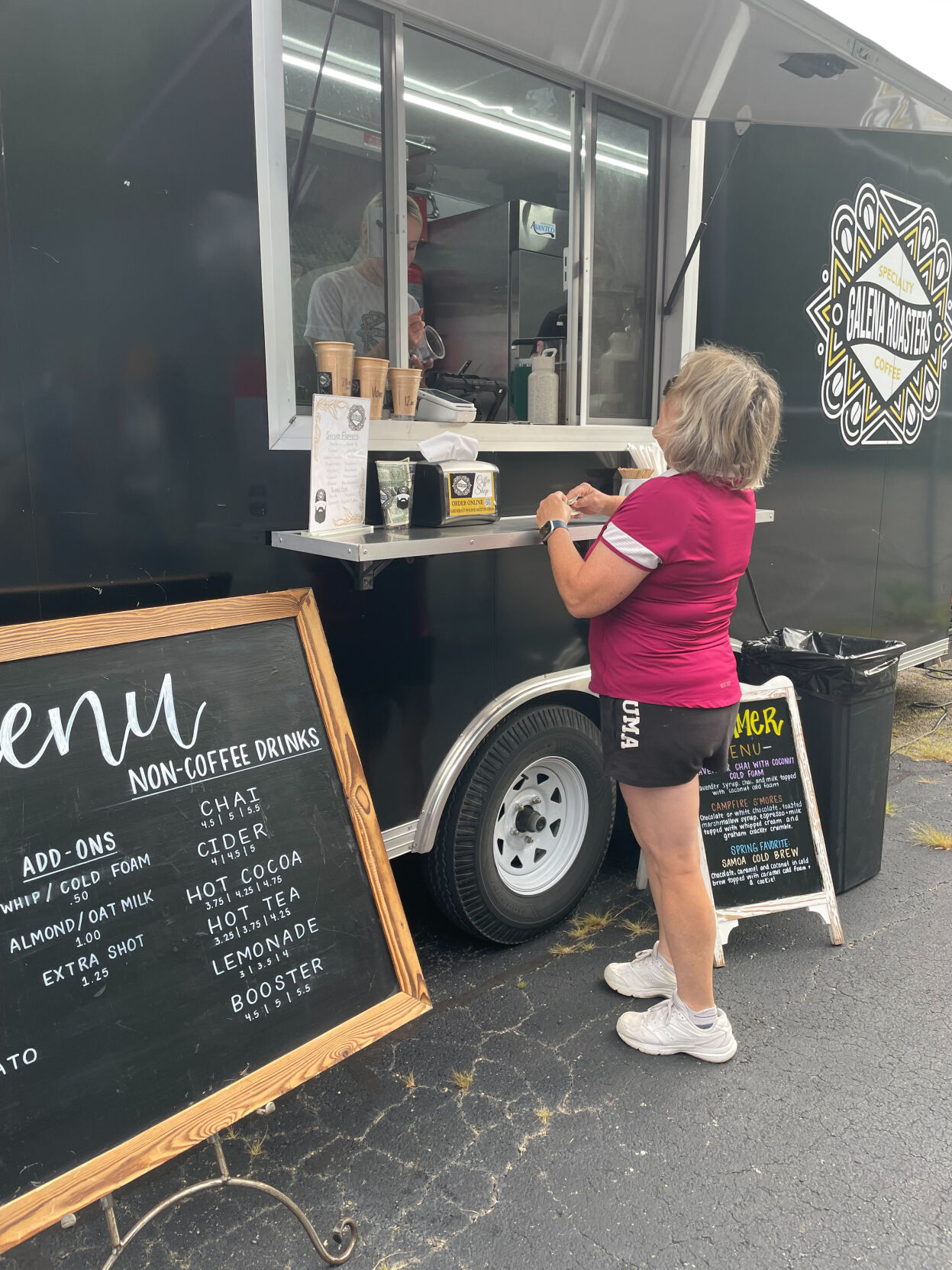 Gail Giglio places her order at the Galena Roasters coffee truck at The Galena Territory Farmers Market.    PHOTO CREDIT: Elizabeth Kelsey
Telegraph Herald