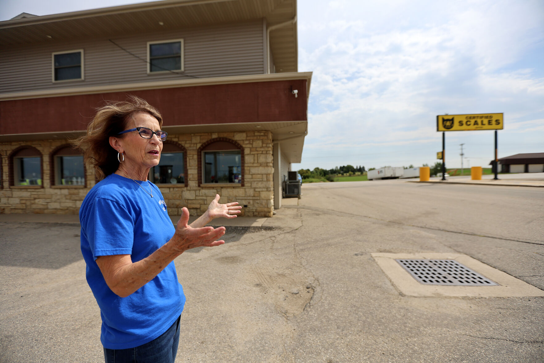 Margie White, co-owner of Highway 20 Auto/Truck Plaza just outside Dubuque, shows the CAT scale (shown at right) that is used by truck drivers.    PHOTO CREDIT: Dave Kettering