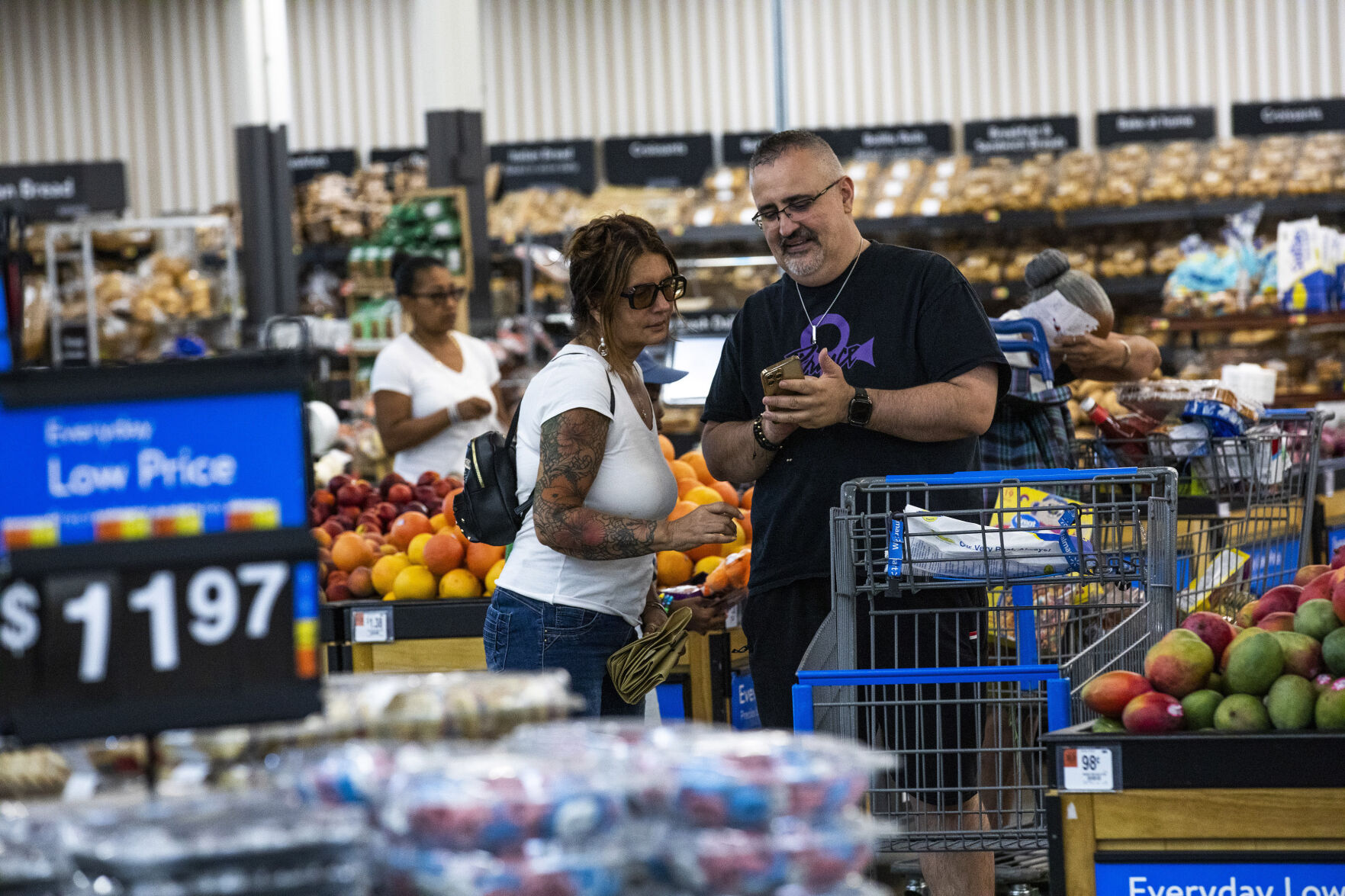 <p>FILE - Shoppers pause in the produce section at a Walmart Superstore in Secaucus, New Jersey, July 11, 2024. (AP Photo/Eduardo Munoz Alvarez, File)</p>   PHOTO CREDIT: Eduardo Munoz Alvarez - freelancer, ASSOCIATED PRESS