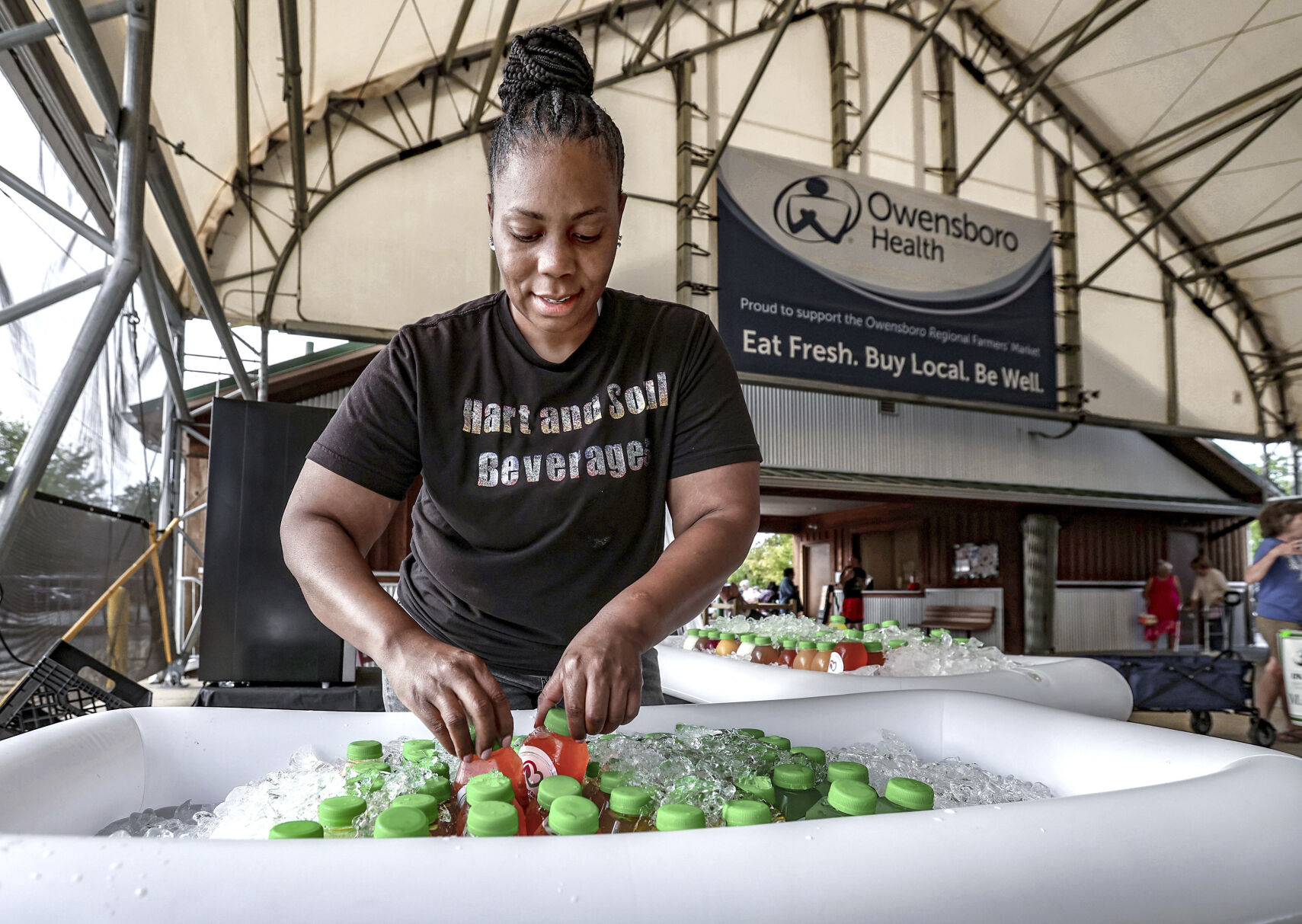 <p>FILE - Crashaunya Hartsfield with Hart and Soul Beverages arranges organic cold-pressed juices, herbal teas, and organic lemonade at the Owensboro Regional Farmers Market in Owensboro, Ky., on Aug. 31, 2024. (Greg Eans/The Messenger-Inquirer via AP, File)</p>   PHOTO CREDIT: Greg Eans - member image share, ASSOCIATED PRESS