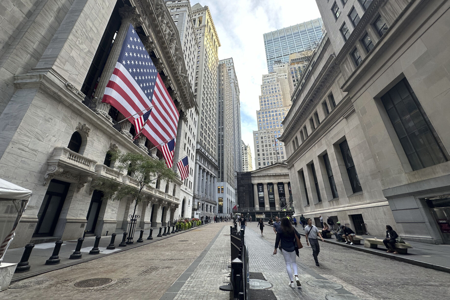 FILE - American flags hang from the front of the New York Stock Exchange on Sept. 11, 2024, in New York. (AP Photo/Peter Morgan, File)    PHOTO CREDIT: Associated Press