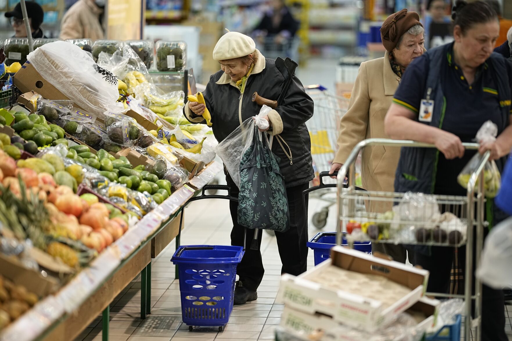 FILE - People buy fruits at a hypermarket in Moscow, Russia, on Nov. 3, 2023. (AP Photo, File)    PHOTO CREDIT: Associated Press