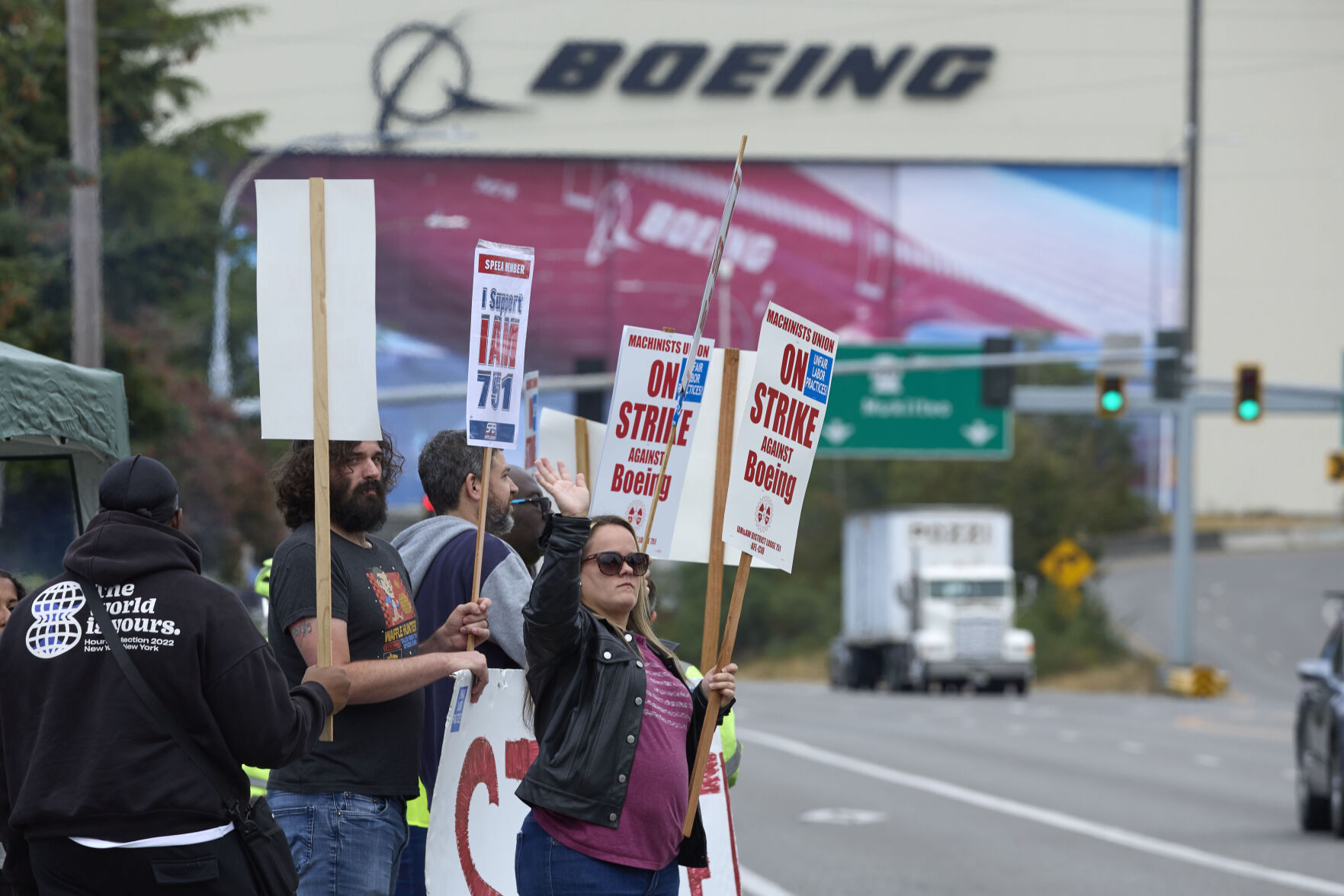 <p>Boeing Machinists Union member Stephanie Corona waves to passing traffic while on the picket line at the Everett plant, Friday, Sept. 13, 2024, in Everett, Wash. (AP Photo/John Froschauer)</p>   PHOTO CREDIT: John Froschauer - freelancer, ASSOCIATED PRESS