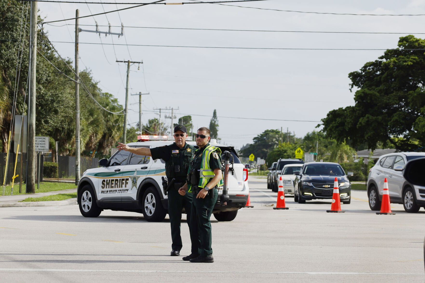 <p>Police officers direct traffic near Trump International Golf Club after the apparent assassination attempt of Republican presidential nominee former President Donald Trump in West Palm Beach, Fla., Sunday, Sept. 15, 2024. (AP Photo/Terry Renna)</p>   PHOTO CREDIT: Terry Renna 