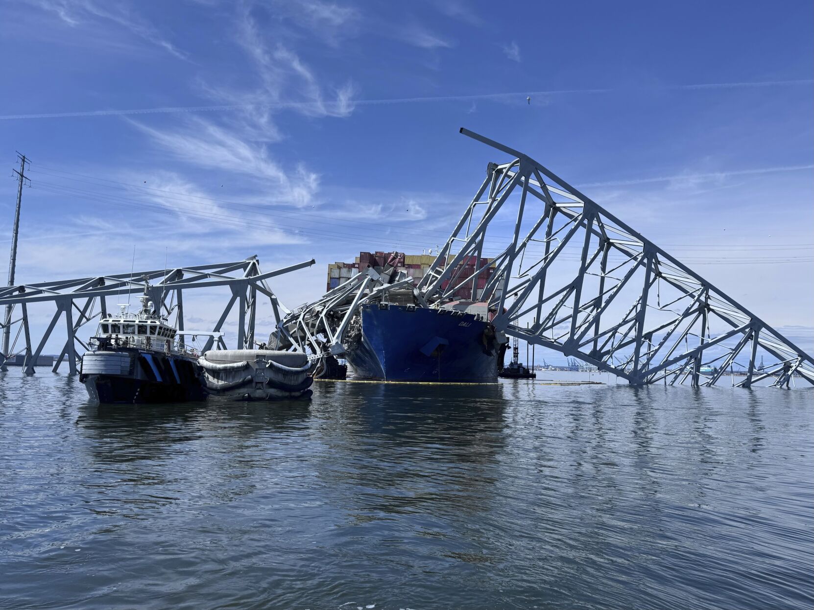 <p>The fallen Francis Scott Key Bridge in Baltimore is pictured Sunday, March 31, 2024, where divers assisted crews with the complicated and meticulous operation of removing steel and concrete. (AP Photos/Mike Pesoli, File)</p>   PHOTO CREDIT: Mike Pesoli